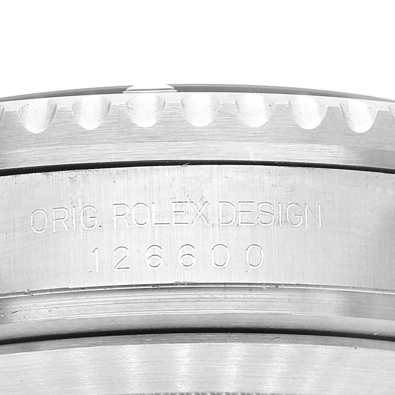 This image shows the side view of the bezel and case of a Rolex Sea-Dweller 126600 Men's Stainless Steel Black Dial 126600 Men's Stainless Steel Black Dial model, featuring the engraved model number 126600.