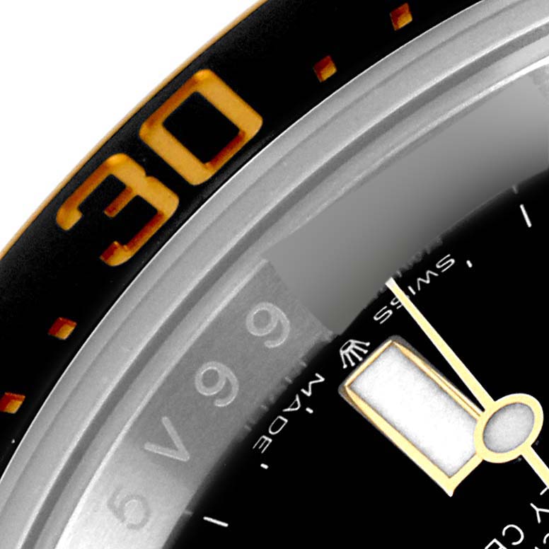 The image shows a close-up of the bezel, part of the chapter ring, and minute hand of a Rolex Sea-Dweller 126603 Men's Steel and Gold (two tone) Black Dial 126603 Men's Steel and Gold (two tone) Black Dial watch.