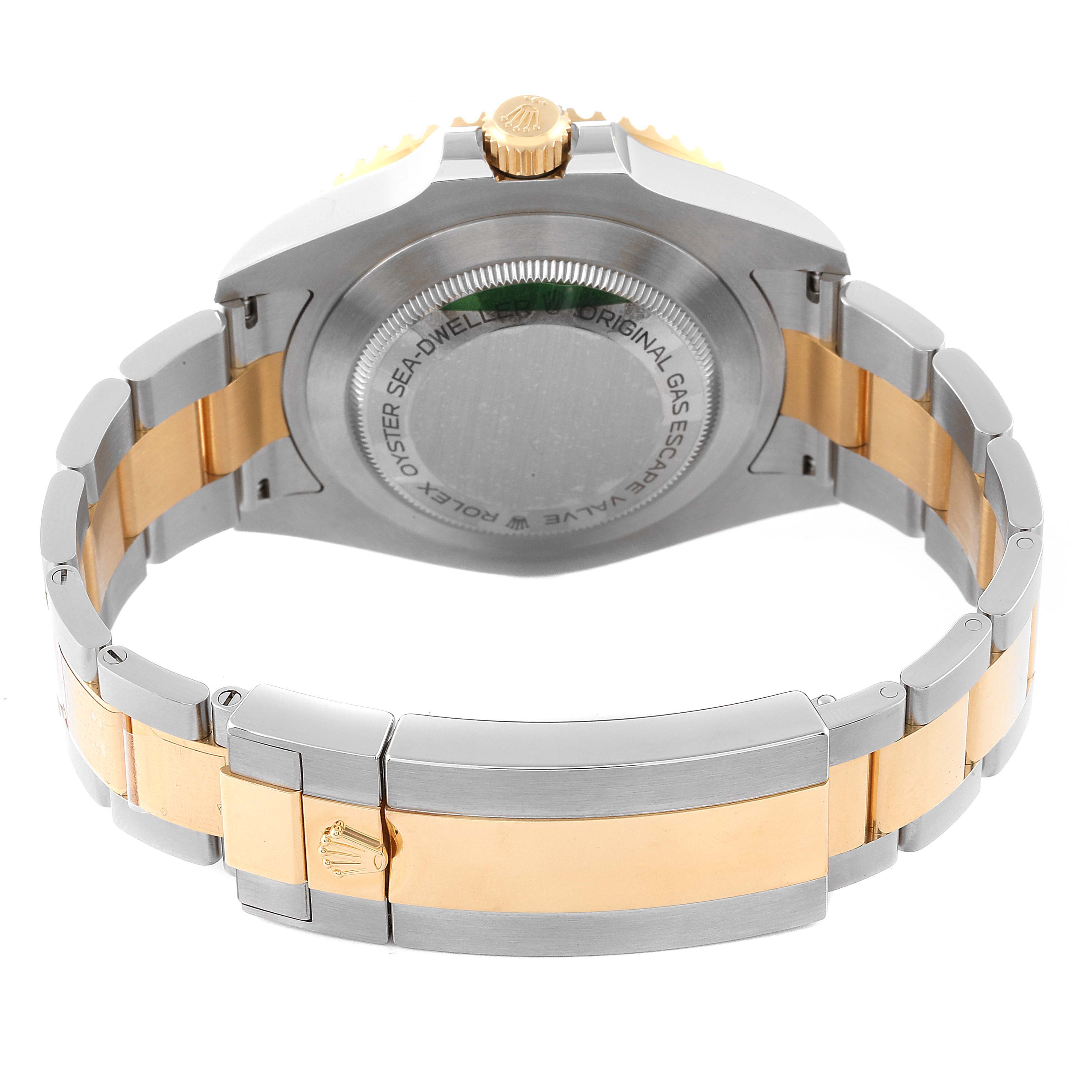 The image shows the back and bracelet of a Rolex Sea-Dweller 126603 Men's Steel and Gold (two tone) Black Dial 126603 Men's Steel and Gold (two tone) Black Dial watch at an elevated rear angle.
