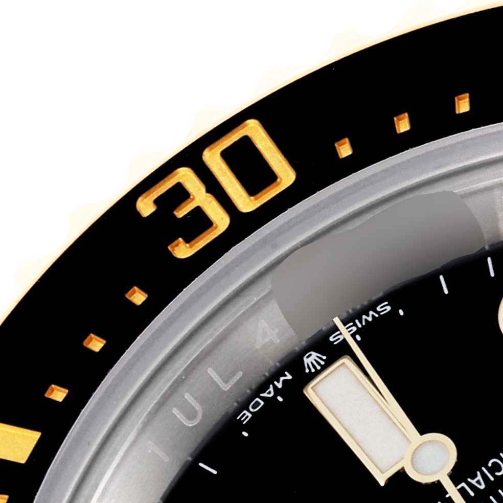 The image shows a close-up angle of the bezel and part of the dial of a Rolex Sea-Dweller 126603 Men
s Steel and Gold (two tone) Black Dial 126603 Men
s Steel and Gold (two tone) Black Dial watch.