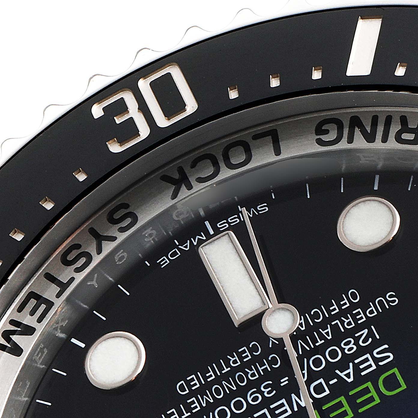 Close-up of the dial and bezel of the Rolex Sea-Dweller 116660 Men
s Stainless Steel Blue Dial 116660 Men
s Stainless Steel Blue Dial, showcasing the bezel
s "30" mark and some dial text.