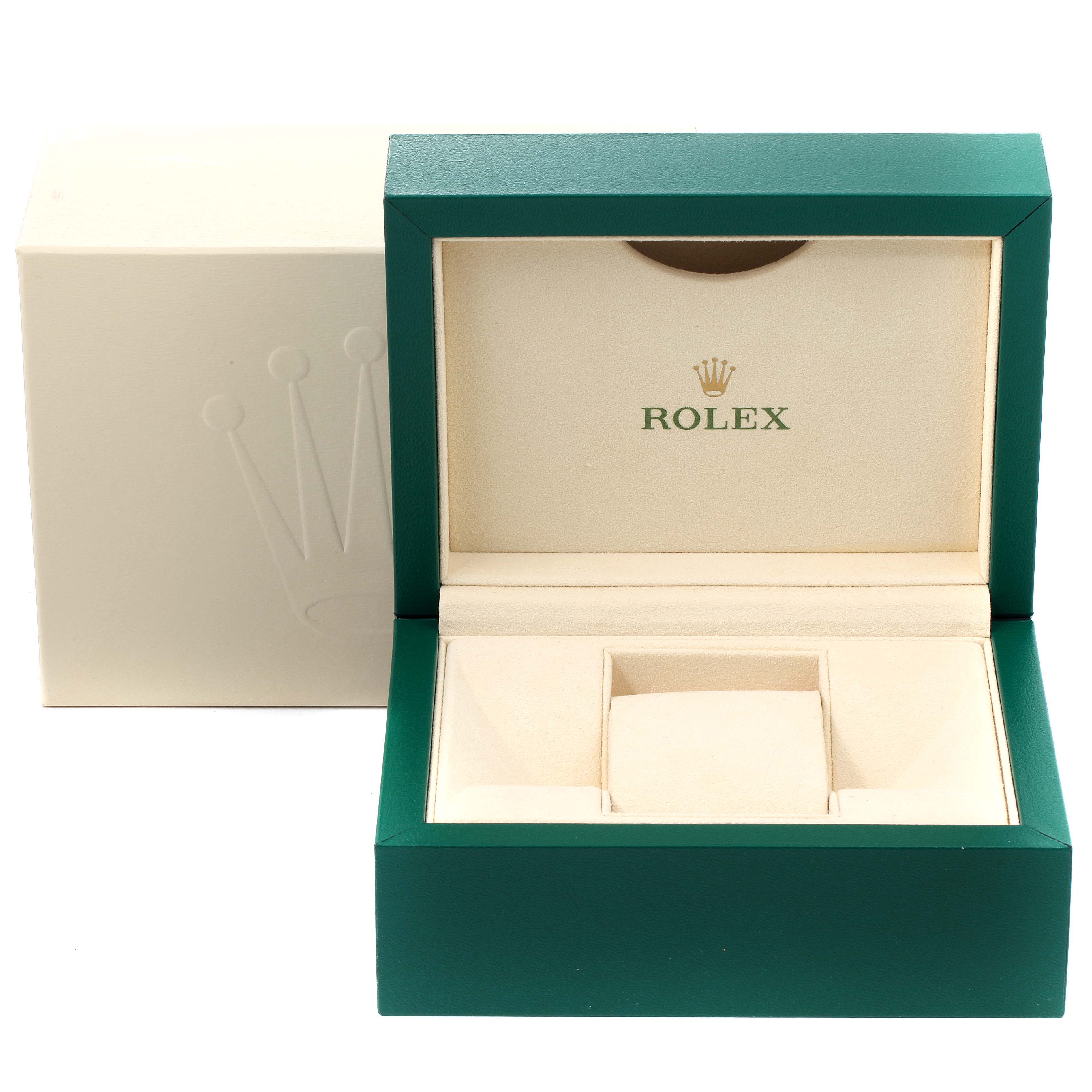 This image shows an open green Rolex Submariner 14060M Men's Stainless Steel Black Dial 14060M Men's Stainless Steel Black Dial watch box with a beige interior and the Rolex logo.