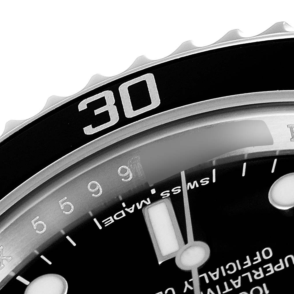 A close-up shot of the bezel and dial of the Rolex Submariner 14060M Men's Stainless Steel Black Dial 14060M Men's Stainless Steel Black Dial watch, showing the "30" marker and part of the minute indices.