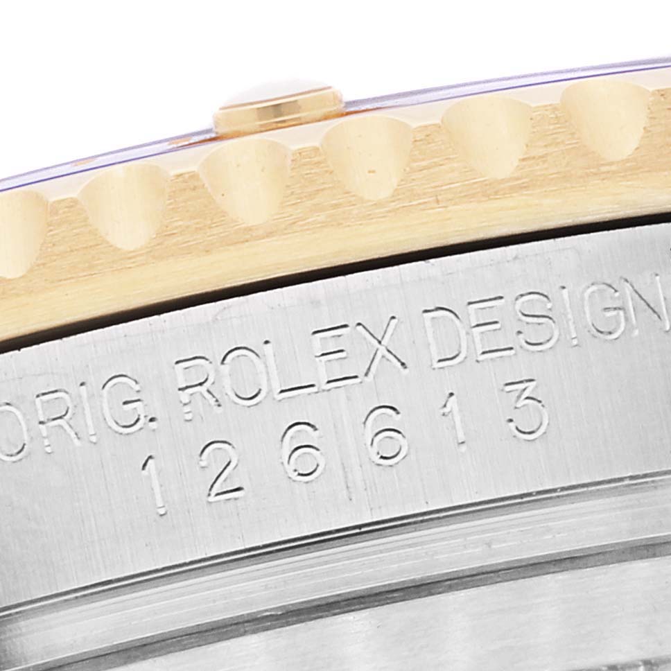 The image shows a close-up of the side of the Rolex Submariner 126613 Men's Steel and Gold (two tone) Blue Dial 126613 Men's Steel and Gold (two tone) Blue Dial watch, highlighting the model number and bezel edge.