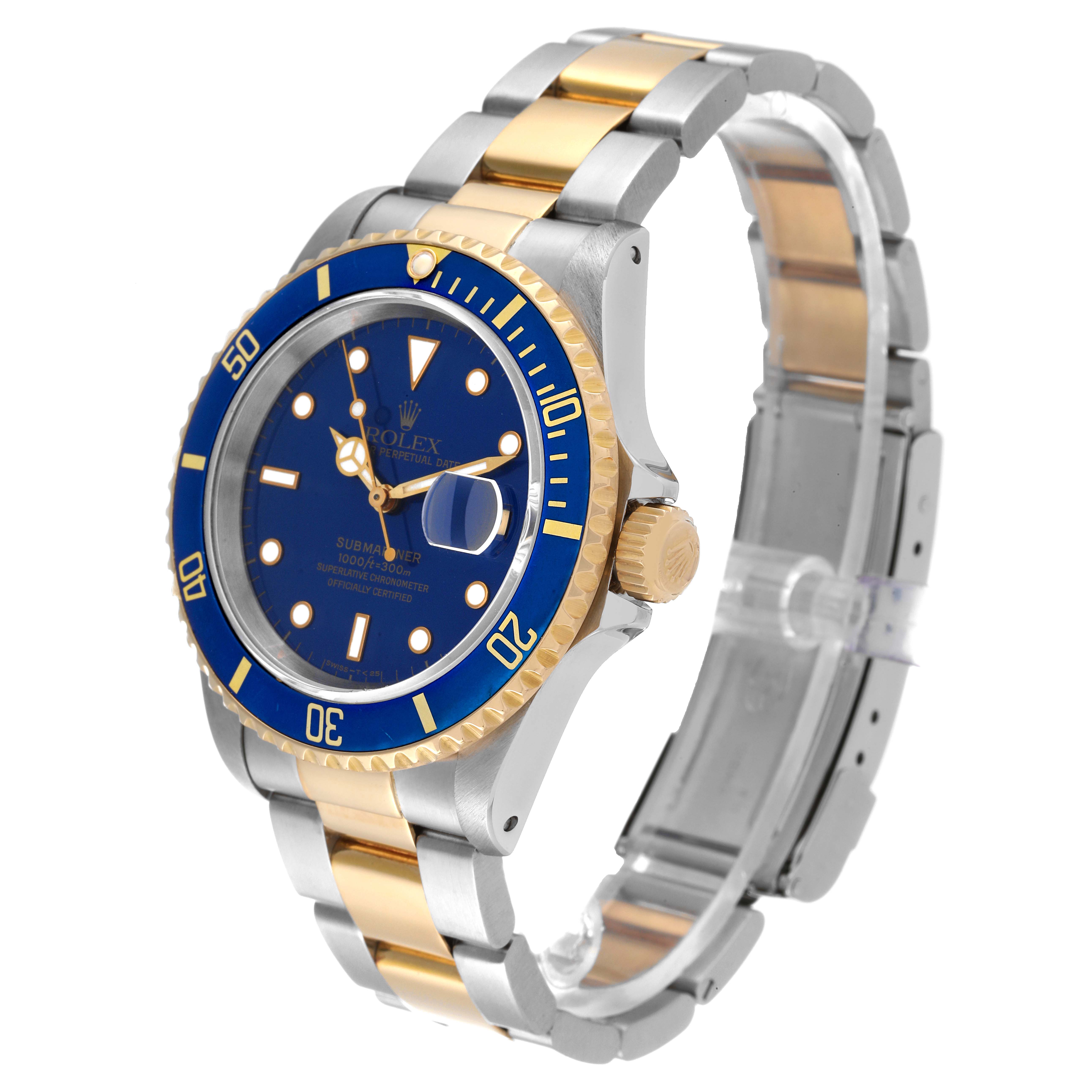 This Rolex Submariner 16613 Men's Steel and Gold (two tone) Blue Dial 16613 Men's Steel and Gold (two tone) Blue Dial watch is shown from a three-quarter angle, highlighting its blue dial, bezel, and two-tone bracelet.