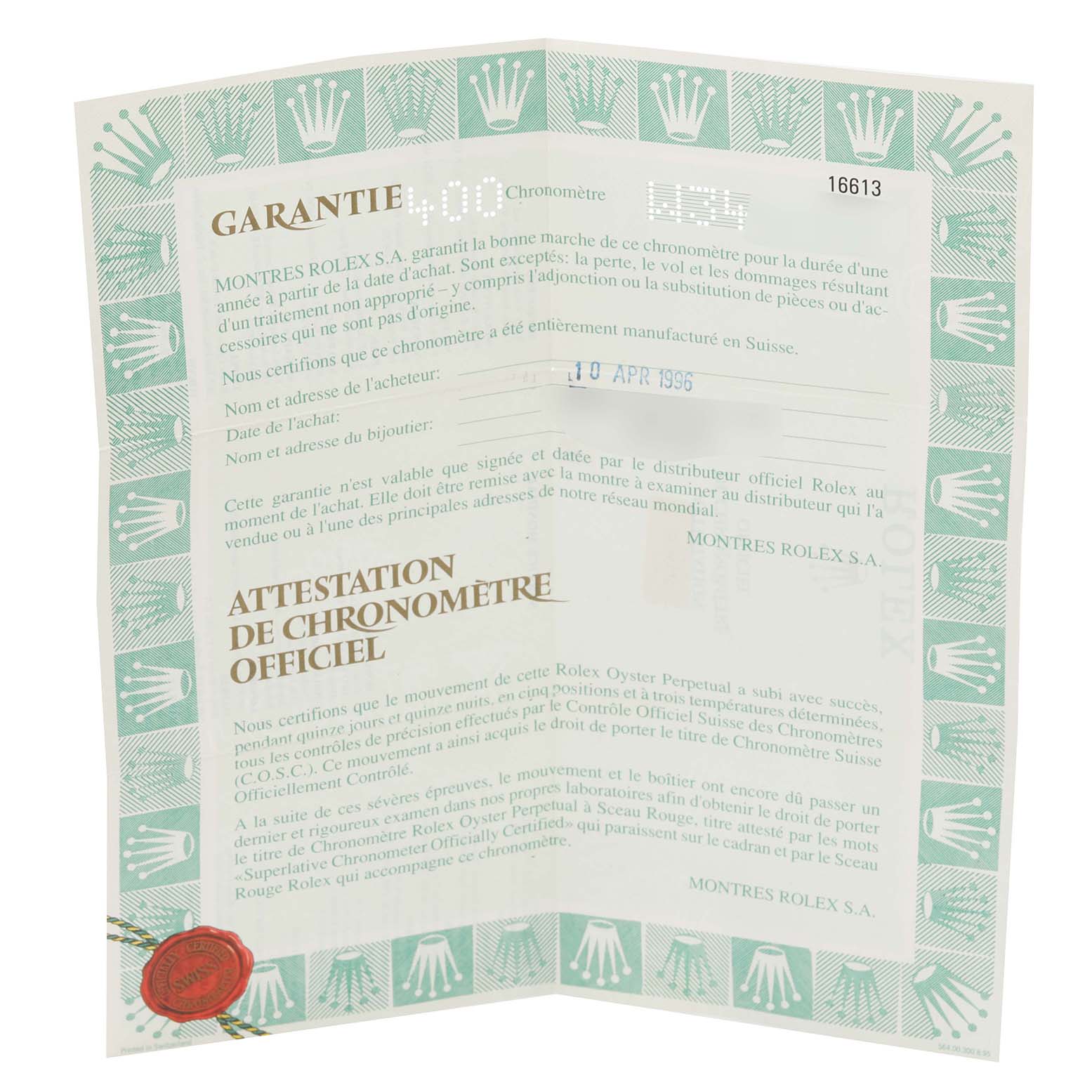 This image shows the warranty certificate of the Rolex Submariner 16613 Men's Steel and Gold (two tone) Blue Dial 16613 Men's Steel and Gold (two tone) Blue Dial watch, displaying the text and official stamps.