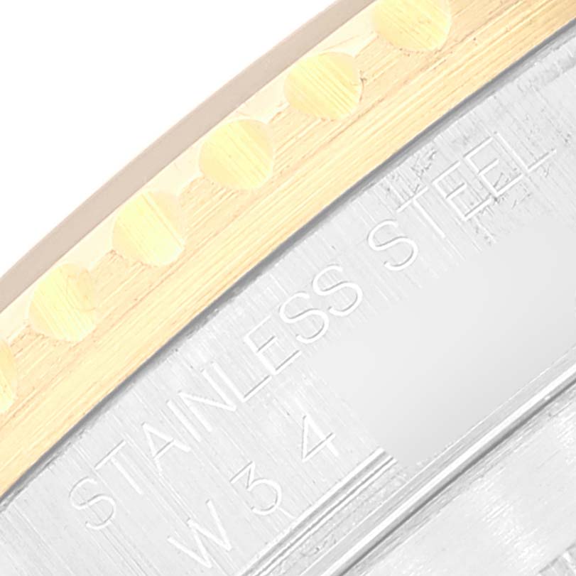 This image shows a close-up of the stainless steel case back and gold bezel of a Rolex Submariner 16613 Men's Steel and Gold (two tone) Blue Dial 16613 Men's Steel and Gold (two tone) Blue Dial watch.