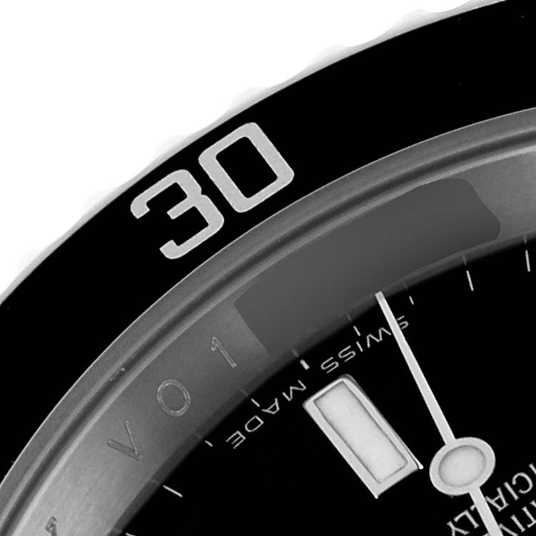 This image shows a partial view of the bezel and the dial of a Rolex Submariner 16610 Men's Stainless Steel Black Dial 16610 Men's Stainless Steel Black Dial watch, featuring the 30-minute mark and "Swiss Made" text.
