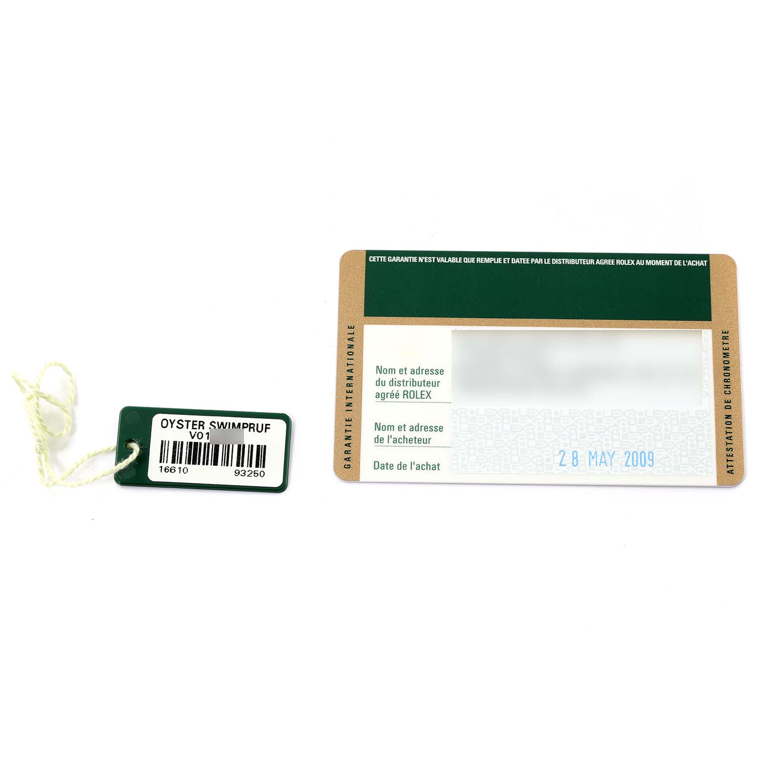 The image shows the warranty card and tag with serial number for a Rolex Submariner 16610 Men's Stainless Steel Black Dial 16610 Men's Stainless Steel Black Dial watch.