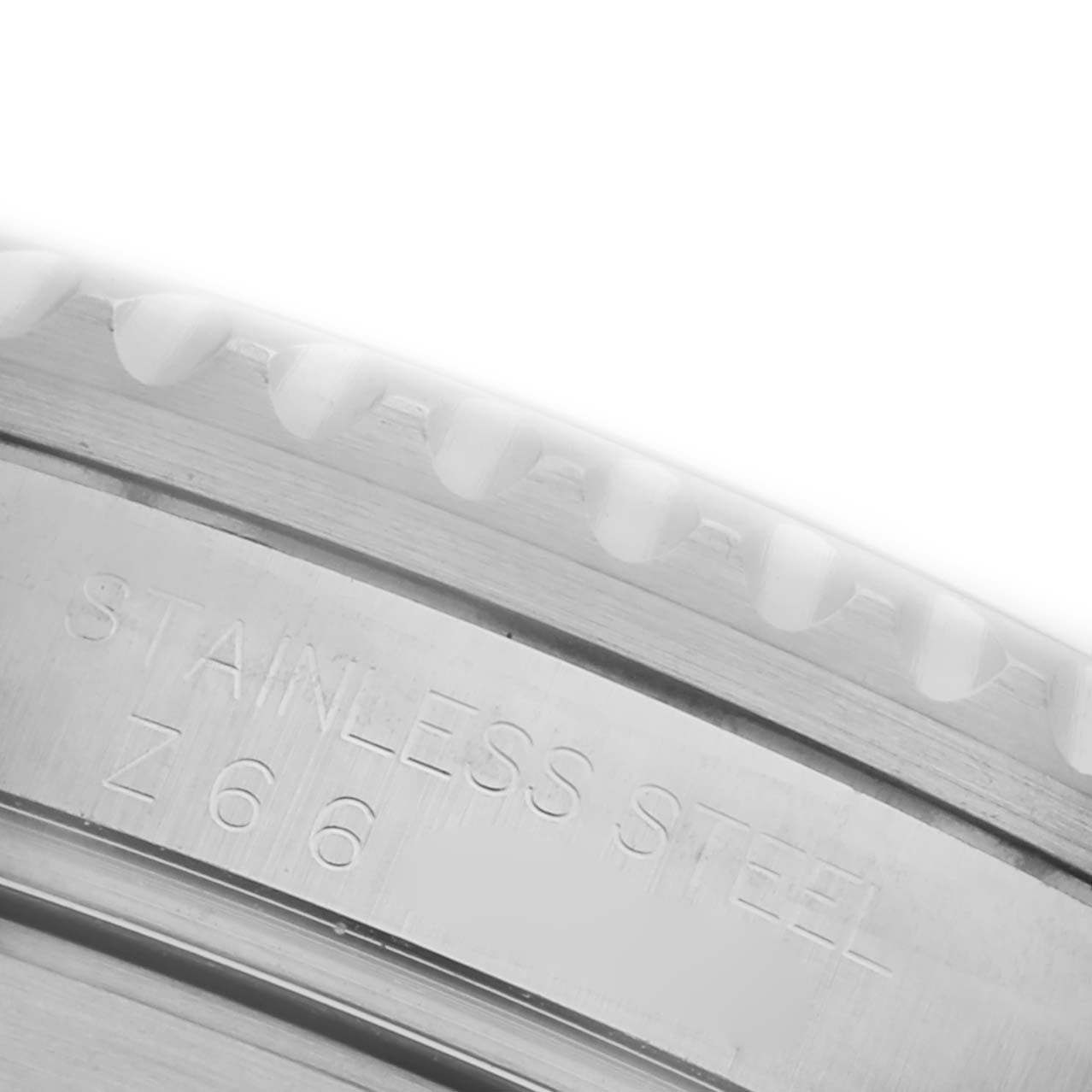 The image shows a close-up view of the bezel edge of a Rolex Submariner 16610 Men's Stainless Steel Black Dial 16610 Men's Stainless Steel Black Dial, highlighting the stainless steel and engraved markings.