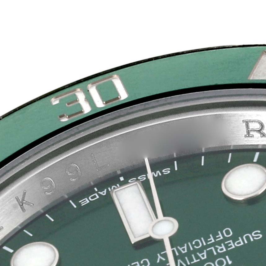 The image shows a close-up of the bezel and part of the dial of a Rolex Submariner 116610LV Men's Stainless Steel Green Dial 116610LV Men's Stainless Steel Green Dial watch.