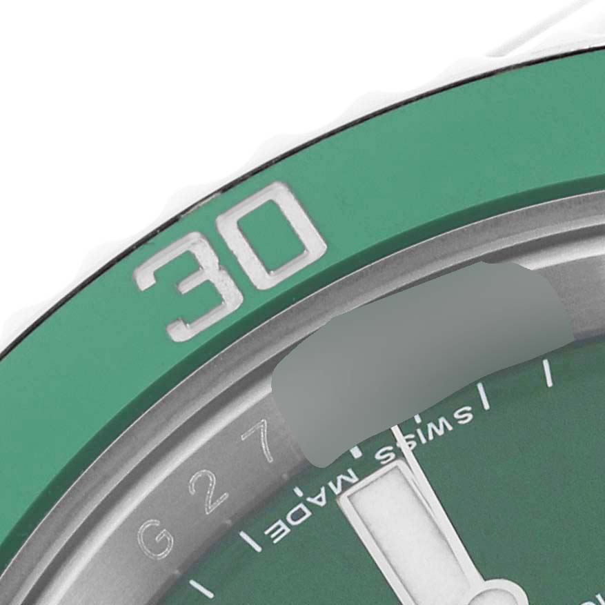 This image shows a close-up of the bezel and part of the dial of a Rolex Submariner 116610LV Men's Stainless Steel Green Dial 116610LV Men's Stainless Steel Green Dial watch, focusing on the 30-minute marker.