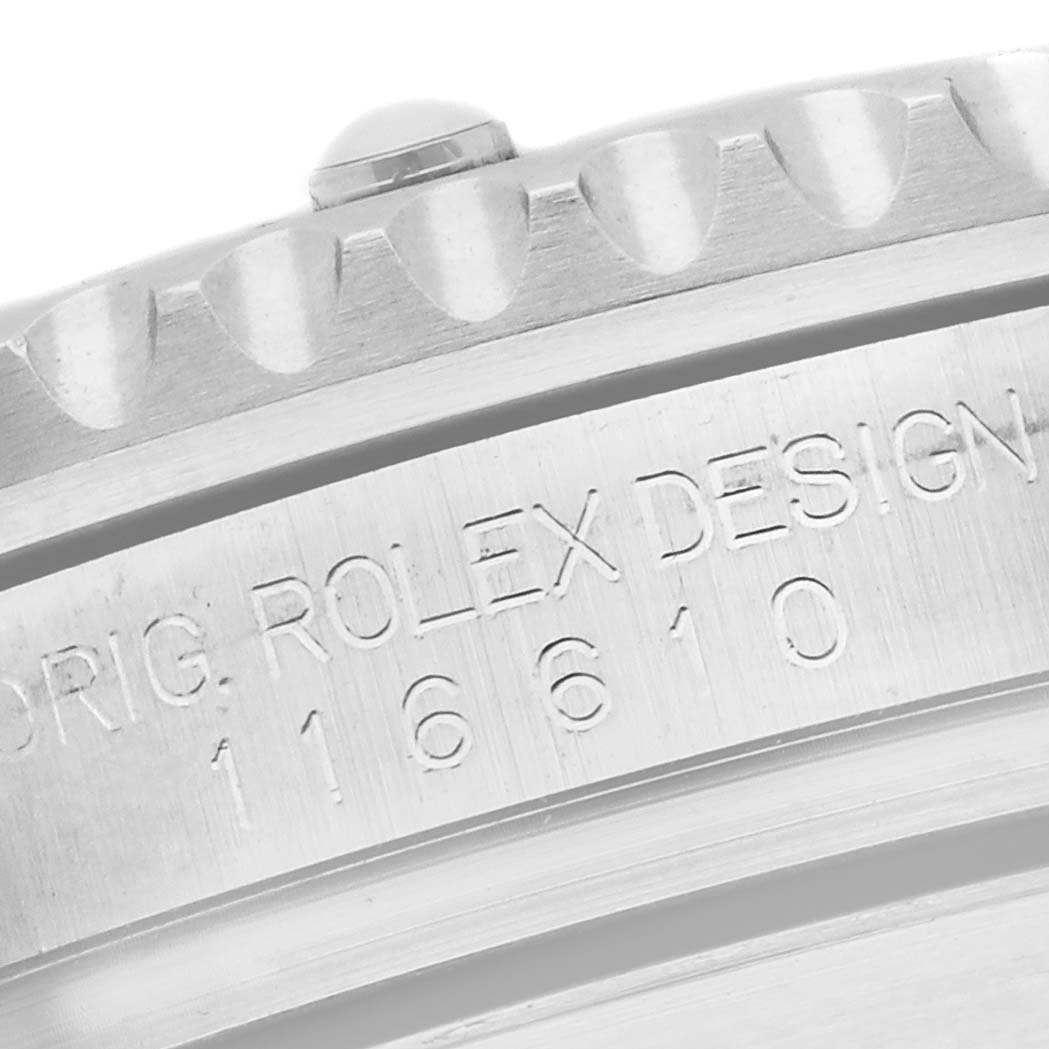 The image shows a close-up of the side of a Rolex Submariner 116610LV Men's Stainless Steel Green Dial 116610LV Men's Stainless Steel Green Dial, highlighting the bezel and engraved serial details.