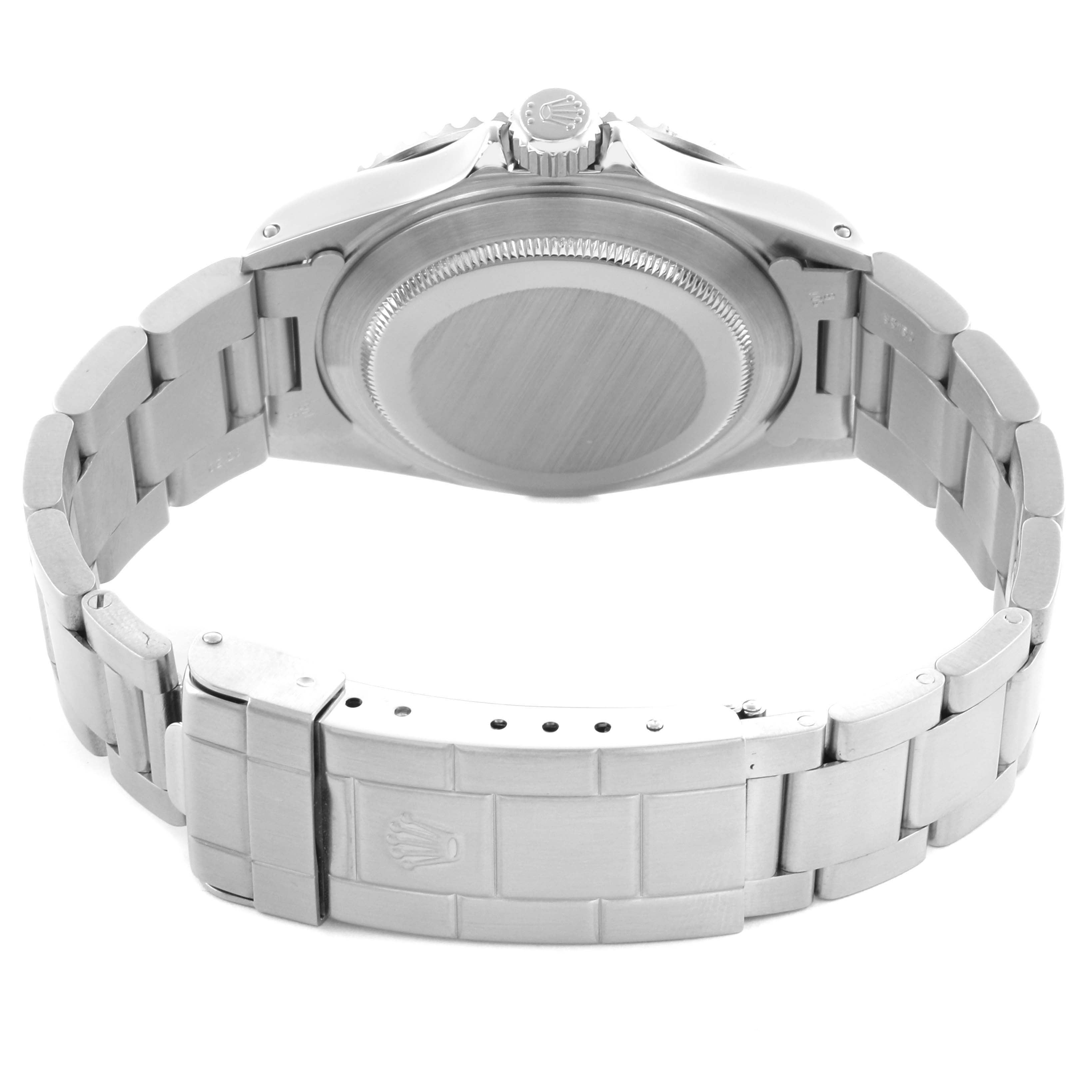 The image shows the Rolex Submariner 14060M Men's Stainless Steel Black Dial 14060M Men's Stainless Steel Black Dial from the back, highlighting the case back, crown, and Oyster bracelet with clasp.