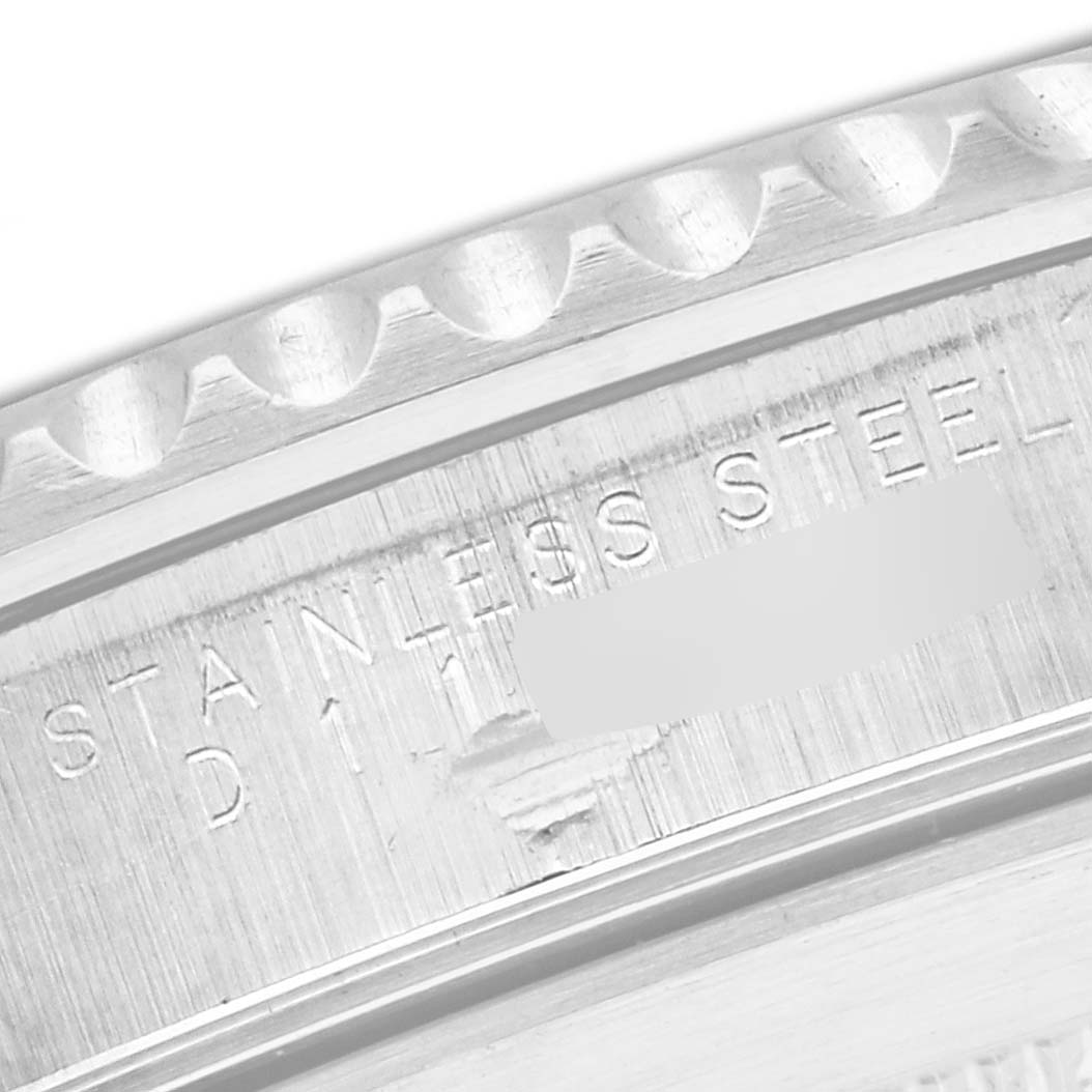 The image shows a close-up of the stainless steel case back with engravings on a Rolex Submariner 14060M Men's Stainless Steel Black Dial 14060M Men's Stainless Steel Black Dial watch.