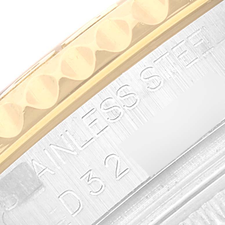 The image shows a close-up of the side of a Rolex Yacht-Master 168623 Men
s Steel and Gold (two tone) White Dial 168623 Men
s Steel and Gold (two tone) White Dial watch, highlighting the stainless steel engravings and part of the bezel.