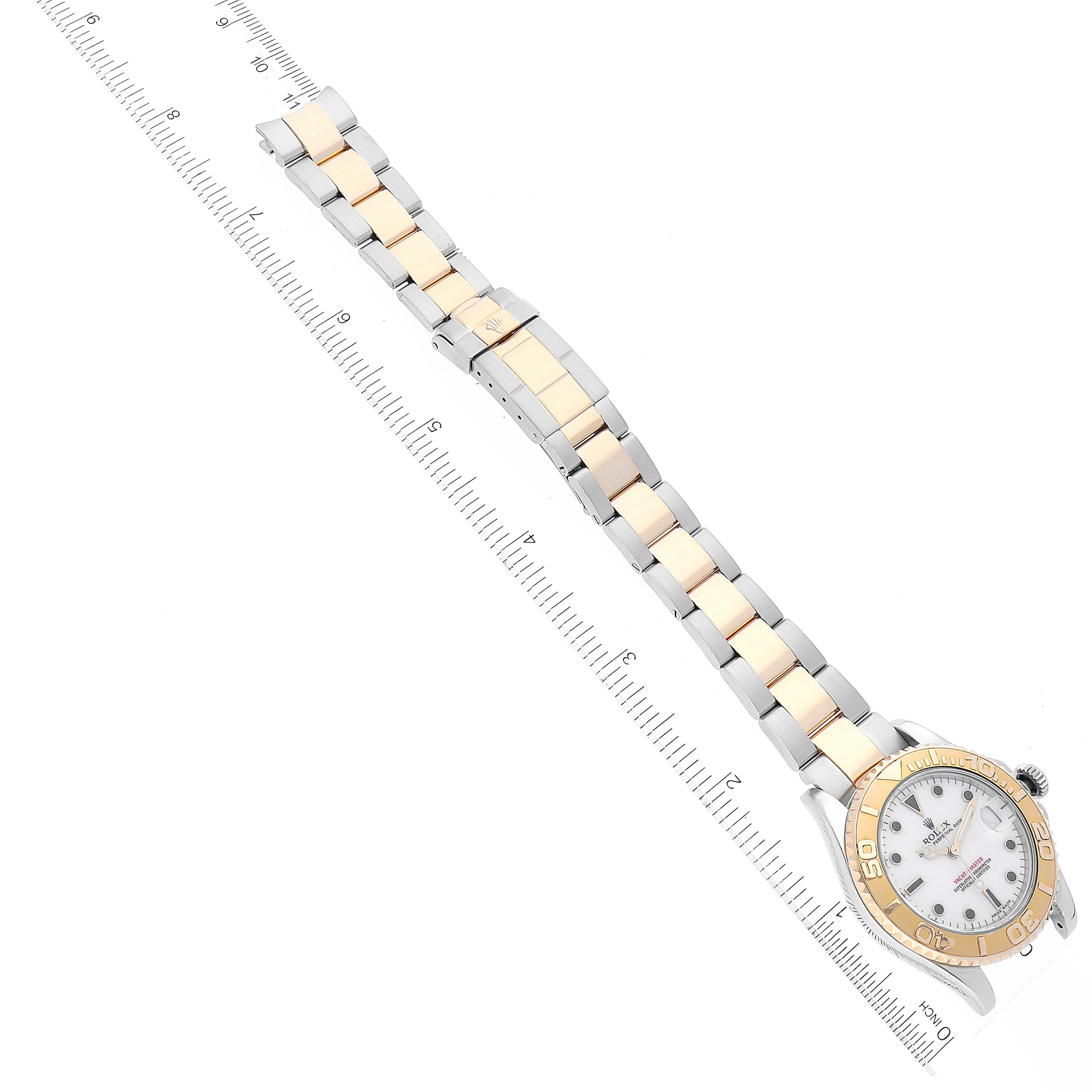 The image shows a top-down view of a Rolex Yacht-Master 168623 Men
s Steel and Gold (two tone) White Dial 168623 Men
s Steel and Gold (two tone) White Dial watch, highlighting its bracelet and face.