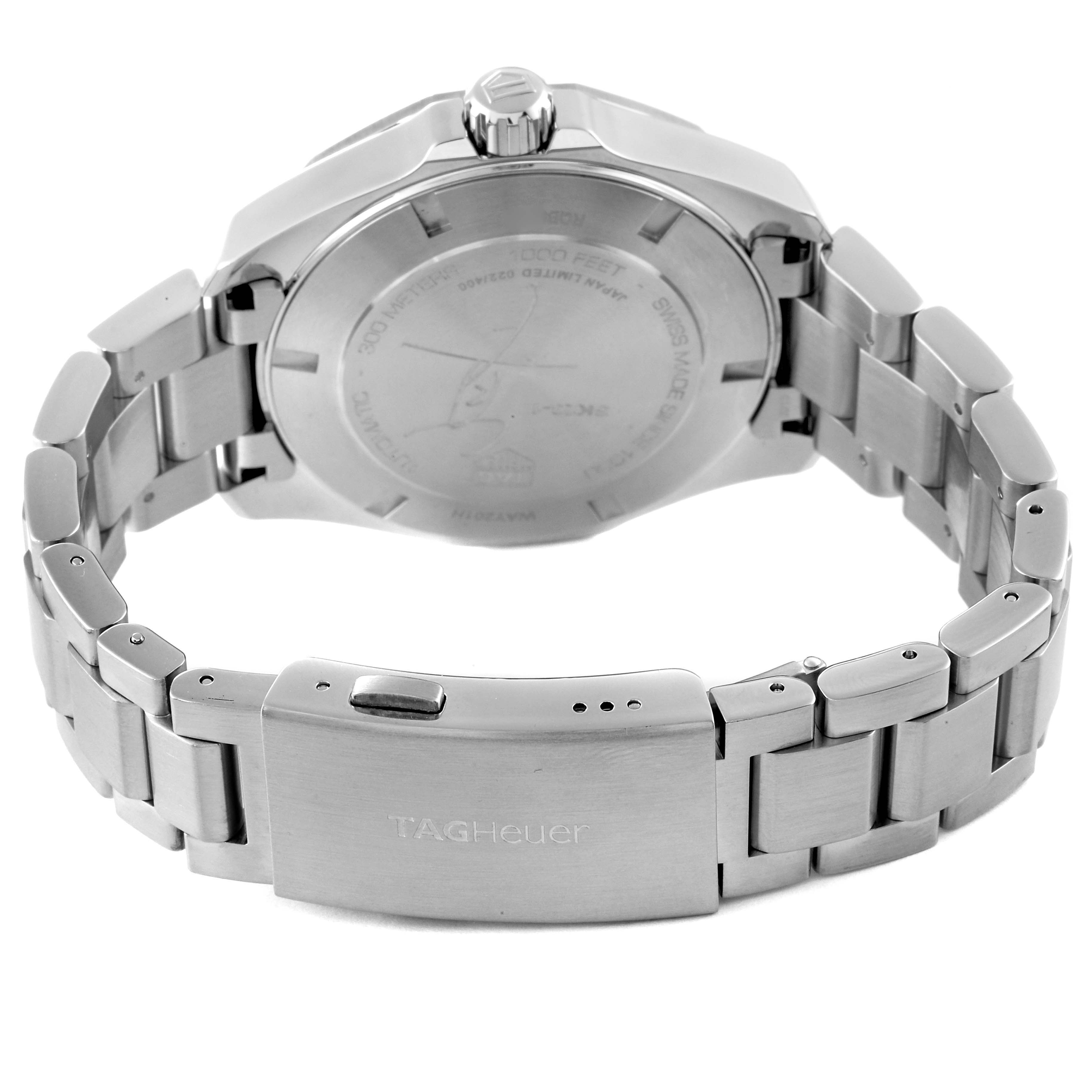 The image shows the back and clasp of the Tag Heuer Limited Edition watch, highlighting its metal bracelet and case back.