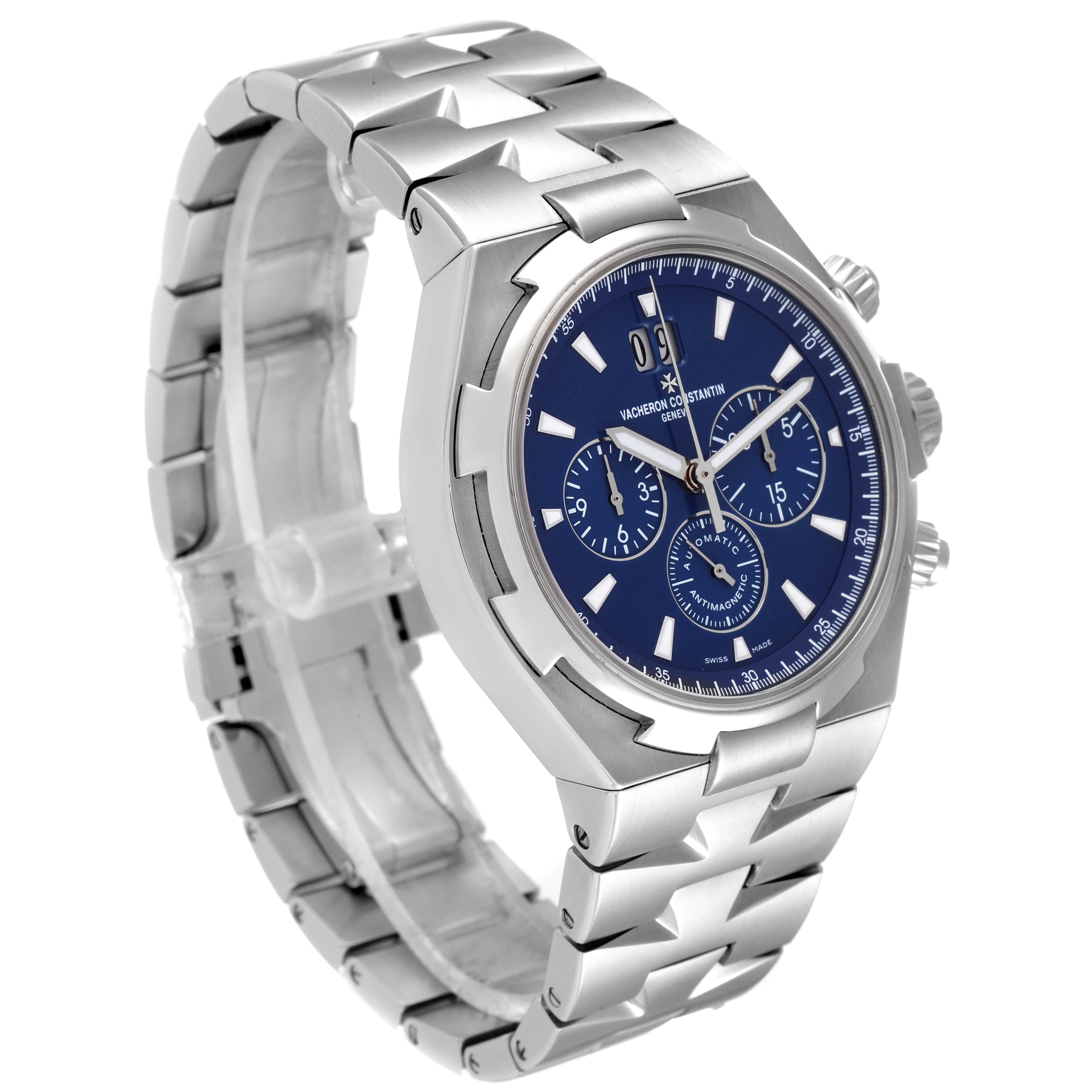The image shows a Vacheron Constantin Overseas 49150.B01A.9097 Men's Stainless Steel Blue Dial 49150.B01A.9097 Men's Stainless Steel Blue Dial watch at a three-quarter angle, highlighting its blue dial, metal bracelet, and chronograph subdials.