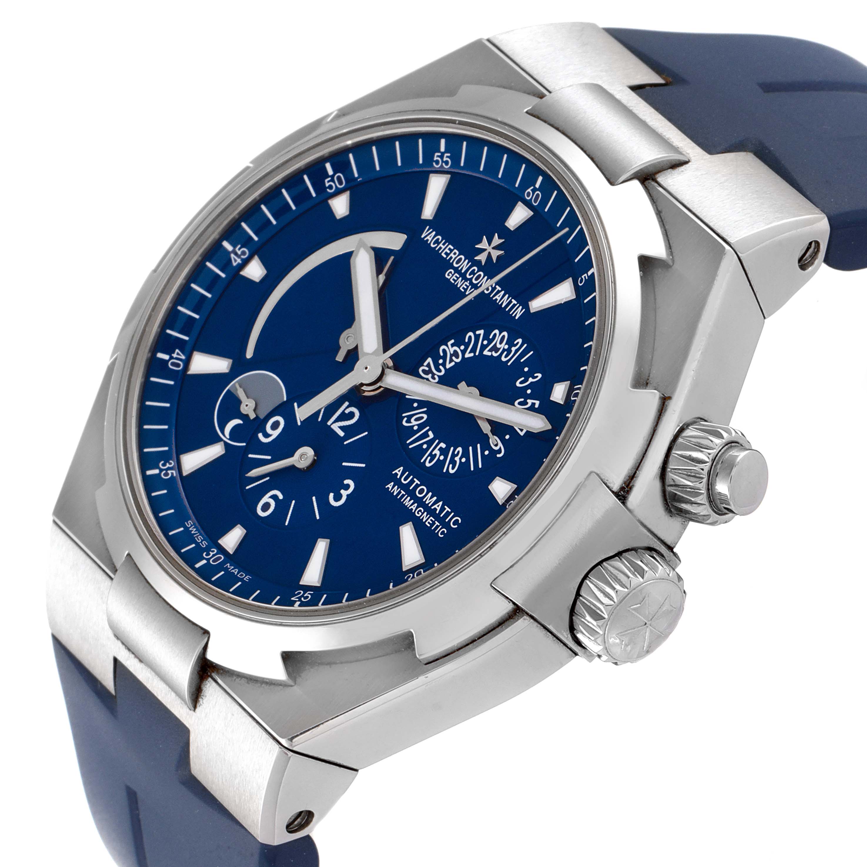 The image shows a Vacheron Constantin Overseas 47450/000A.9039 Men
s Stainless Steel Blue Dial 47450/000A.9039 Men
s Stainless Steel Blue Dial watch at an angle highlighting the blue dial, crown, and part of the strap.