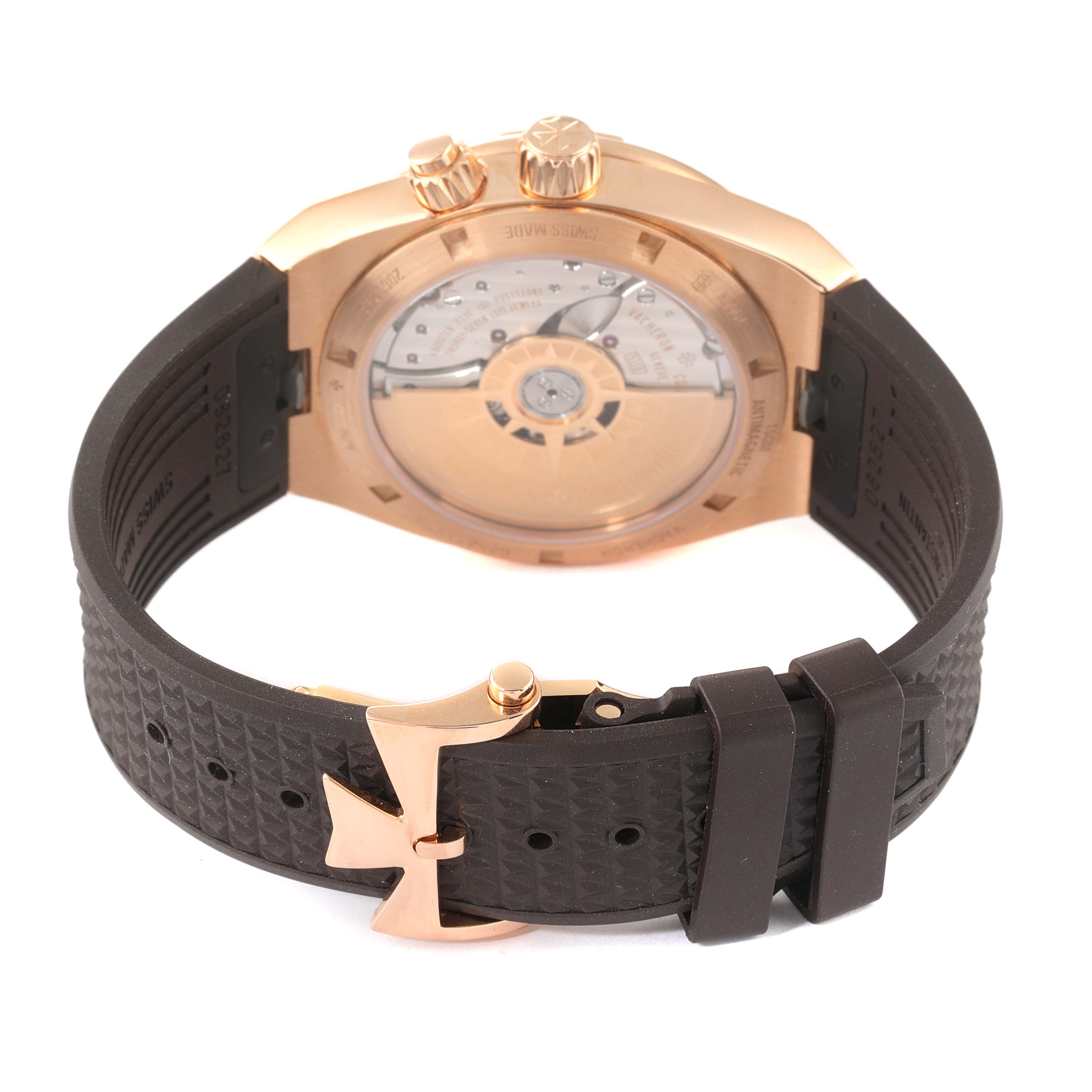 The image shows the rear view of the Vacheron Constantin Overseas 7900V/000R-B336 Men's Rose Gold Silver Dial 7900V/000R-B336 Men's Rose Gold Silver Dial watch, displaying the case back and black strap with a clasp.