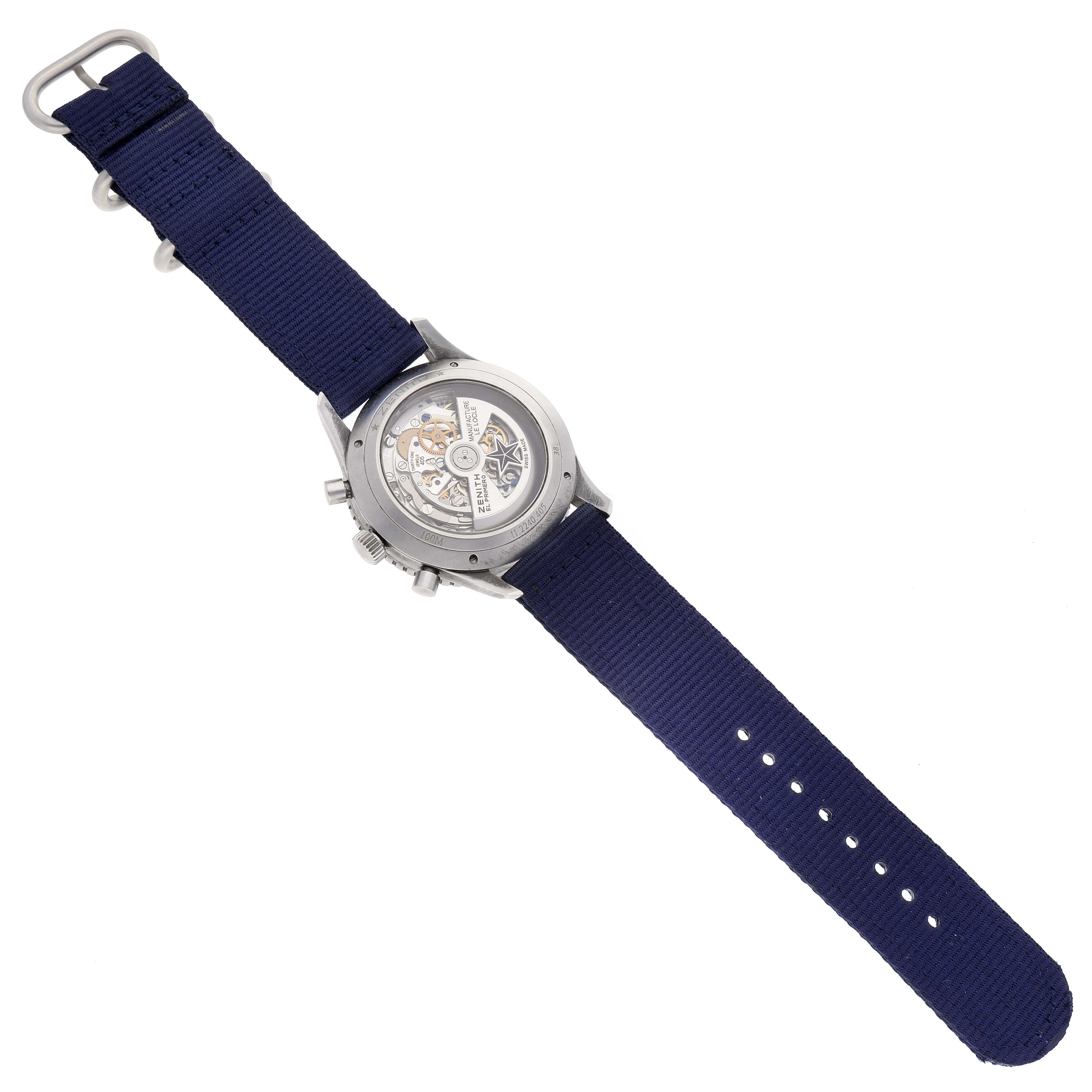 The Zenith Pilot 11.2240.405 Men's Stainless Steel Grey Dial 11.2240.405 Men's Stainless Steel Grey Dial watch is shown from the back, revealing its open case back and a blue strap.