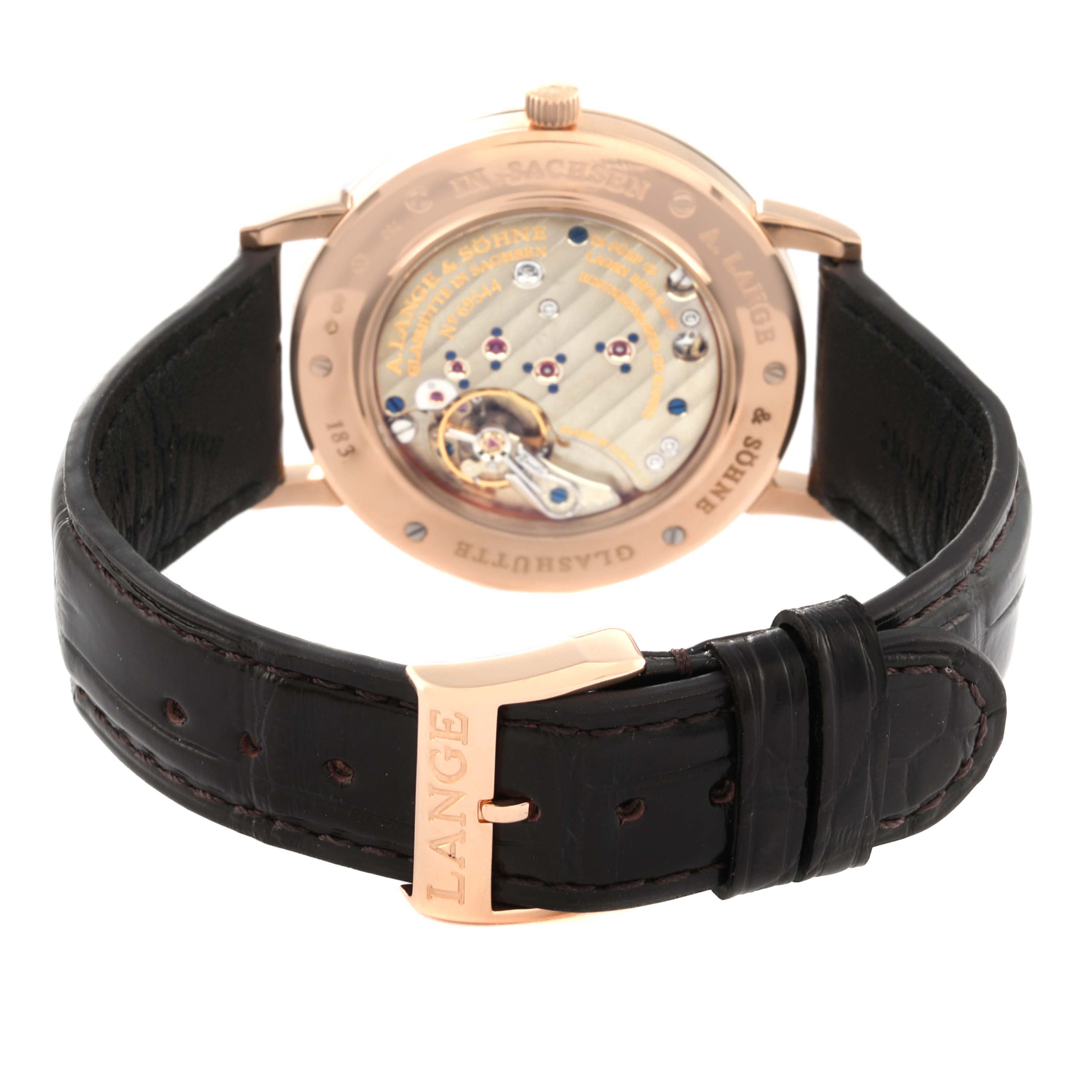 This image shows the back view of a Saxonia model by A. Lange & Söhne with a visible movement and a leather strap.