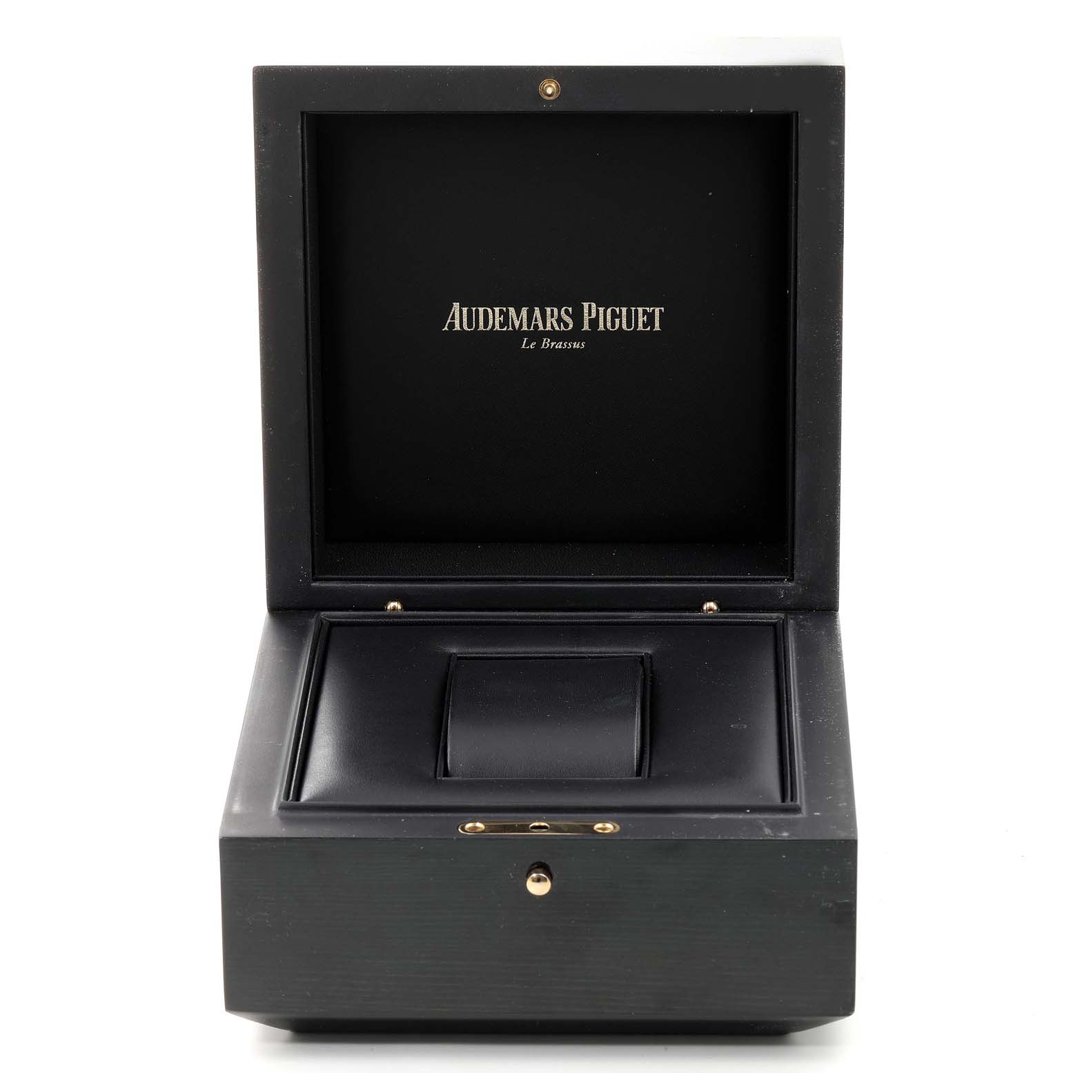 The image shows an open black Audemars Piguet Royal Oak Offshore 25721TI  Men's Titanium Grey Dial 25721TI  Men's Titanium Grey Dial watch box displaying the brand name on the interior.