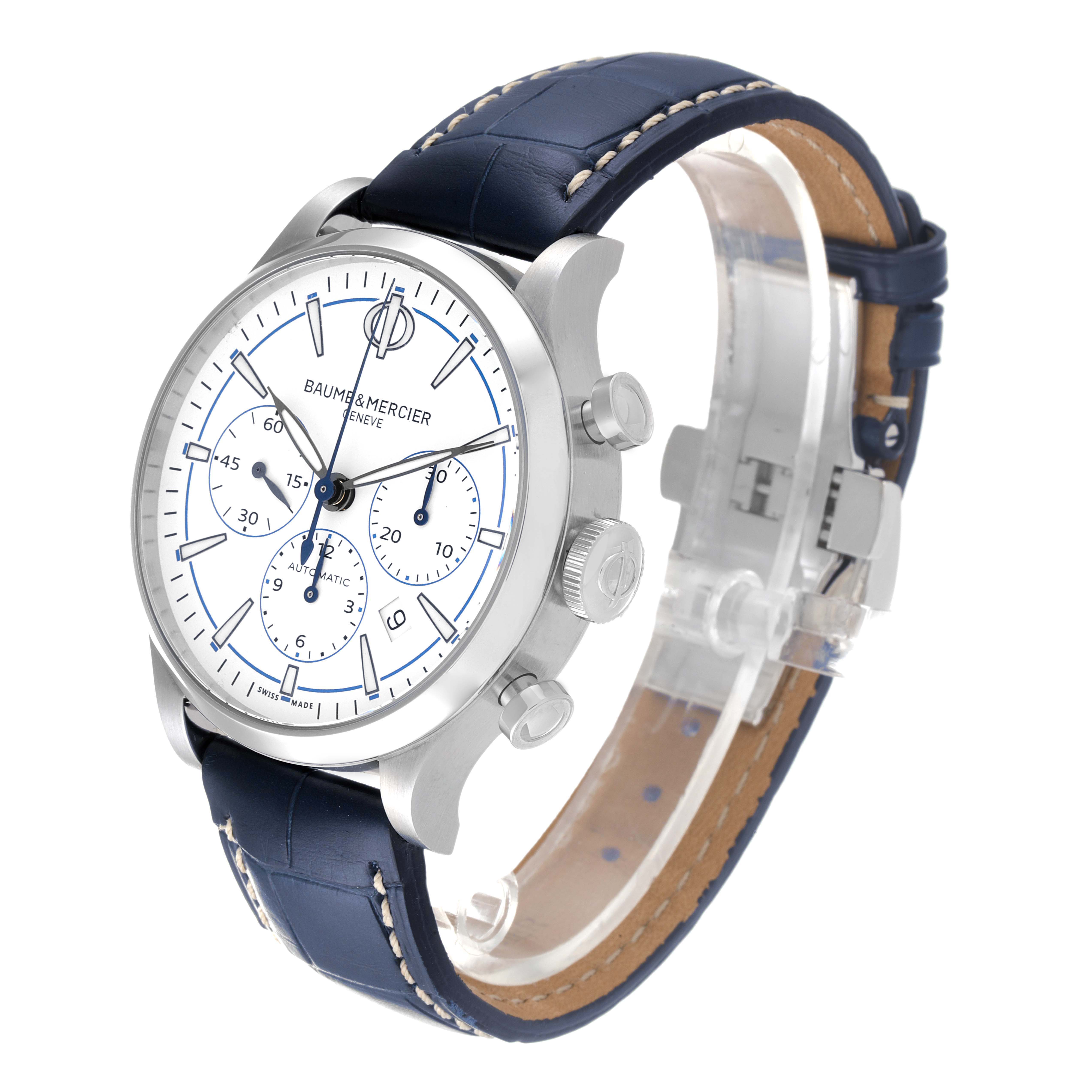 The Baume & Mercier Capeland MOA10437 Men's Stainless Steel White Dial MOA10437 Men's Stainless Steel White Dial watch is shown at a three-quarter angle, highlighting its blue leather strap, chronograph dials, and side pushers.