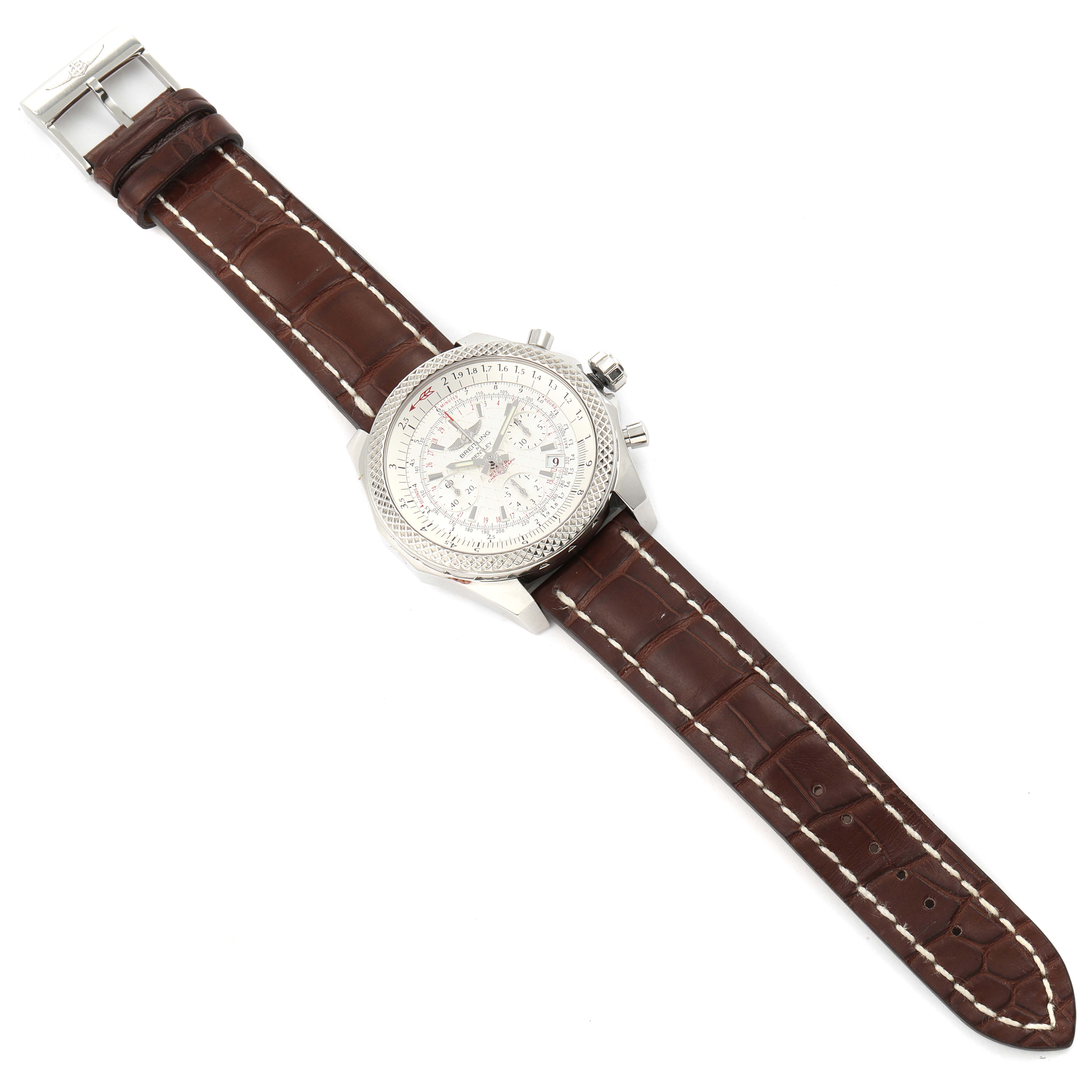 The Breitling Bentley AB0521U0/A768/789P/A20BA.1 Men's Stainless Steel Silver Dial AB0521U0/A768/789P/A20BA.1 Men's Stainless Steel Silver Dial watch is shown from a top-down angle, displaying its face, case, and brown leather strap.