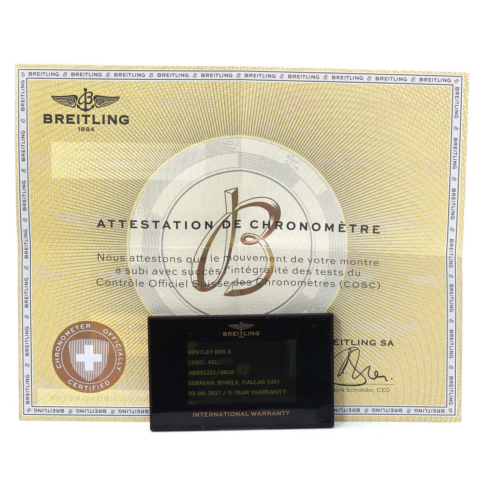 This image shows the warranty card and chronometer certificate for the Bentley model by Breitling.