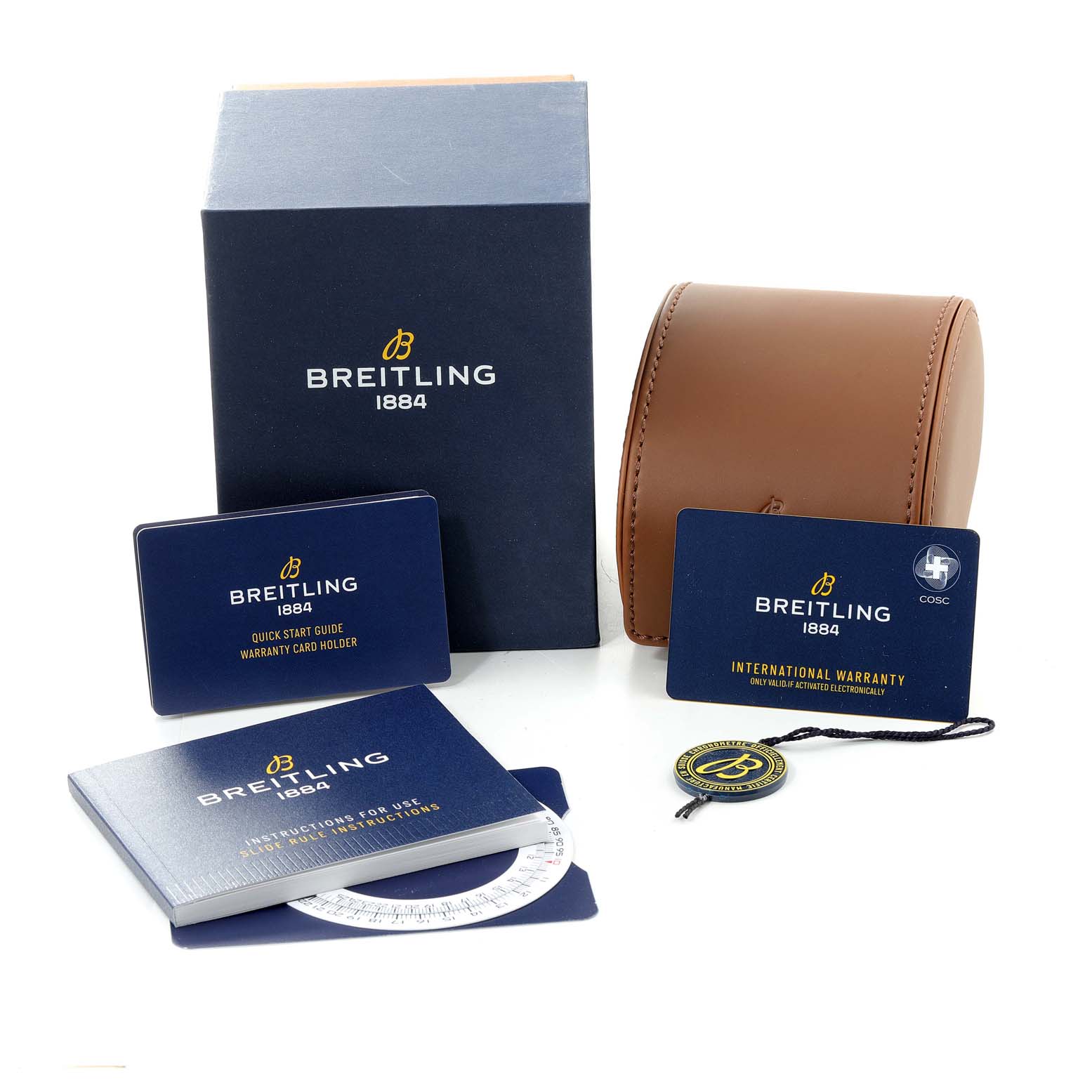 The image shows the packaging and accessories for a Breitling Navitimer AB0127211C1A1 Men's Stainless Steel Blue Dial AB0127211C1A1 Men's Stainless Steel Blue Dial, including manuals, an international warranty card, and a leather case.