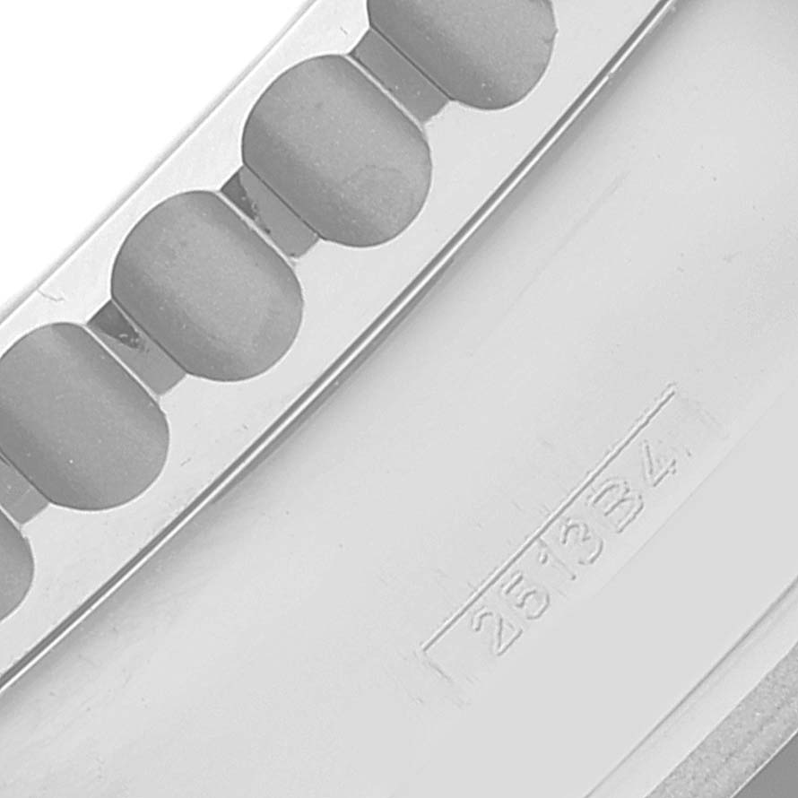 This is a close-up of the bracelet link and serial number of a Breitling Navitimer AB0120 Men's Stainless Steel Black Dial AB0120 Men's Stainless Steel Black Dial watch.