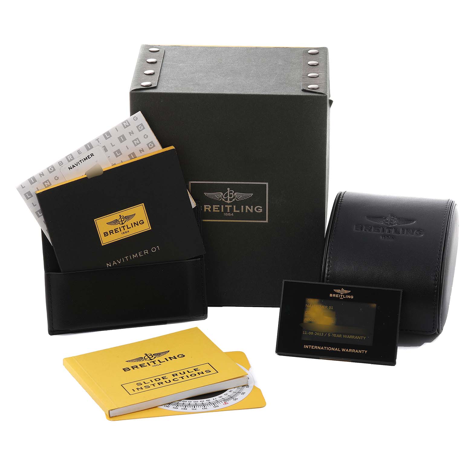 The image shows packaging and accessories for the Breitling Navitimer AB0120 Men's Stainless Steel Black Dial AB0120 Men's Stainless Steel Black Dial watch, including boxes, booklets, and an international warranty card.