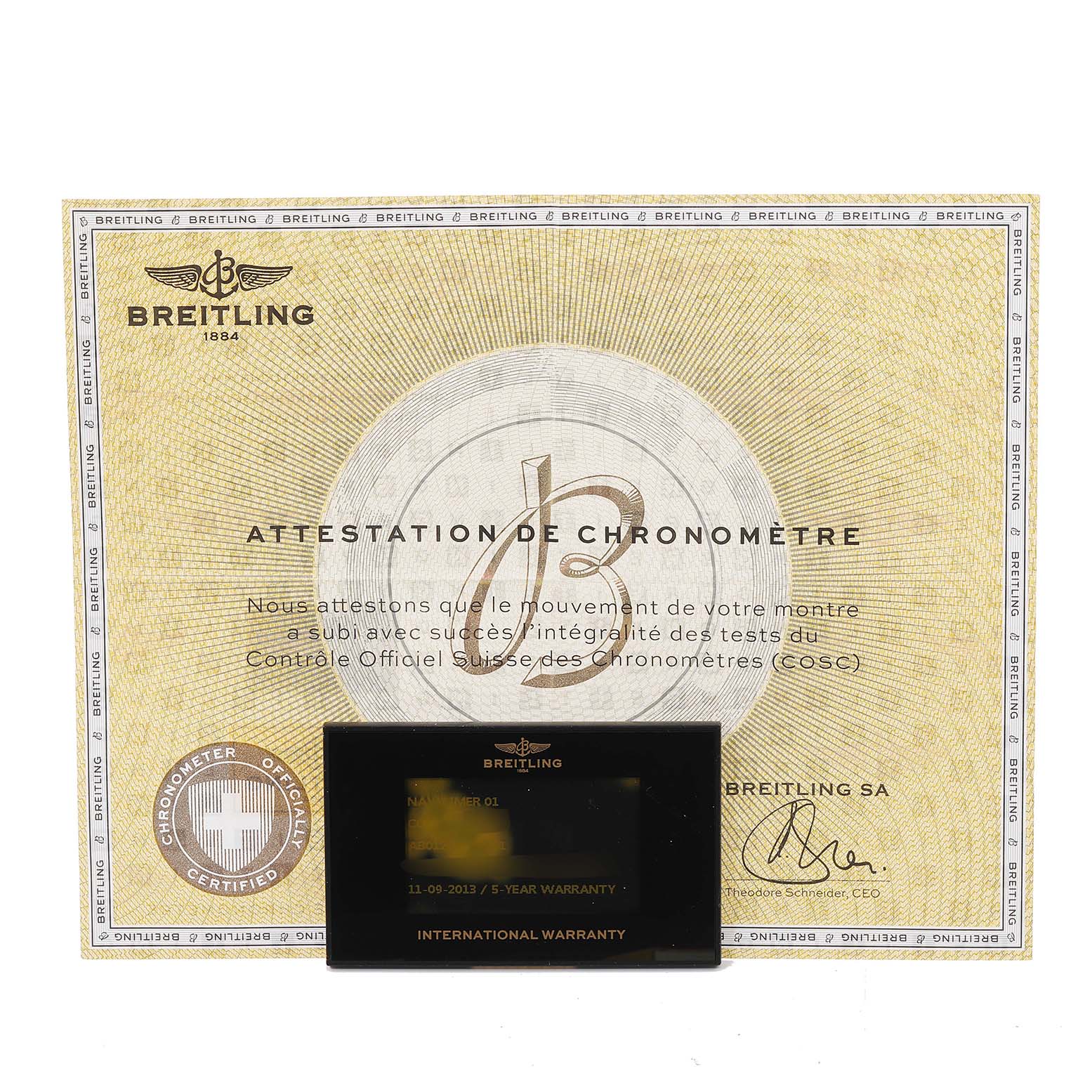 The image shows the Breitling Navitimer AB0120 Men's Stainless Steel Black Dial AB0120 Men's Stainless Steel Black Dial's certificate of chronometer and the international warranty card.