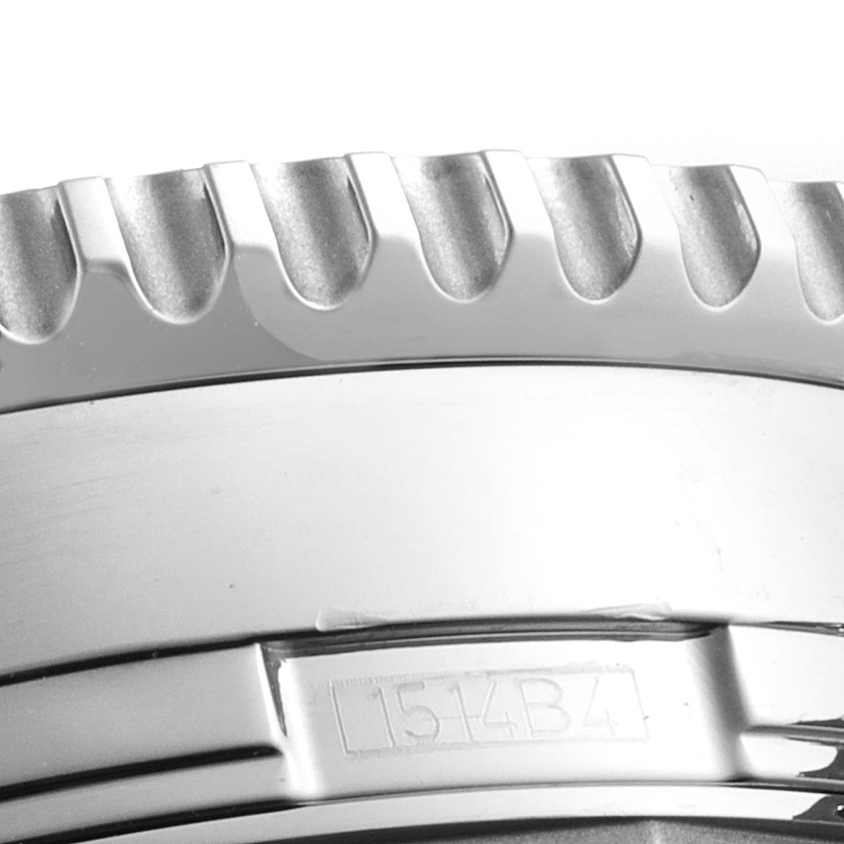 This image shows a close-up of the bezel and part of the case of a Breitling Navitimer A24322 Men's Stainless Steel Black Dial A24322 Men's Stainless Steel Black Dial watch.