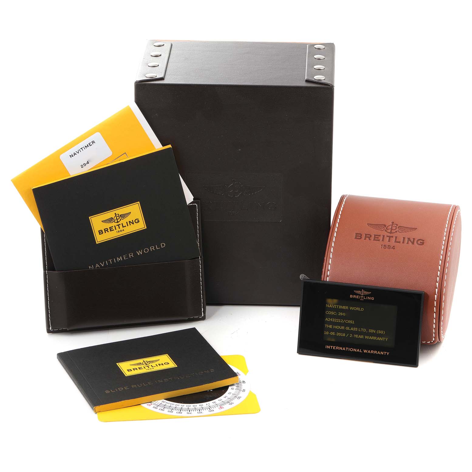 The image shows Breitling Navitimer A24322 Men
s Stainless Steel Blue Dial A24322 Men
s Stainless Steel Blue Dial model accessories, including boxes, manuals, and an international warranty card.