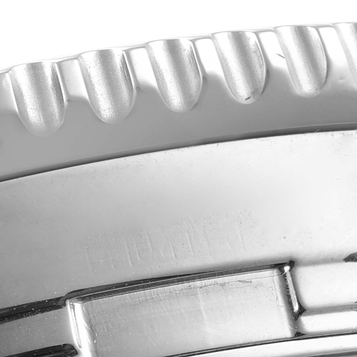 This close-up image shows the serrated edge and part of the bezel of the Breitling Navitimer A24322 Men's Stainless Steel Silver Dial A24322 Men's Stainless Steel Silver Dial watch.