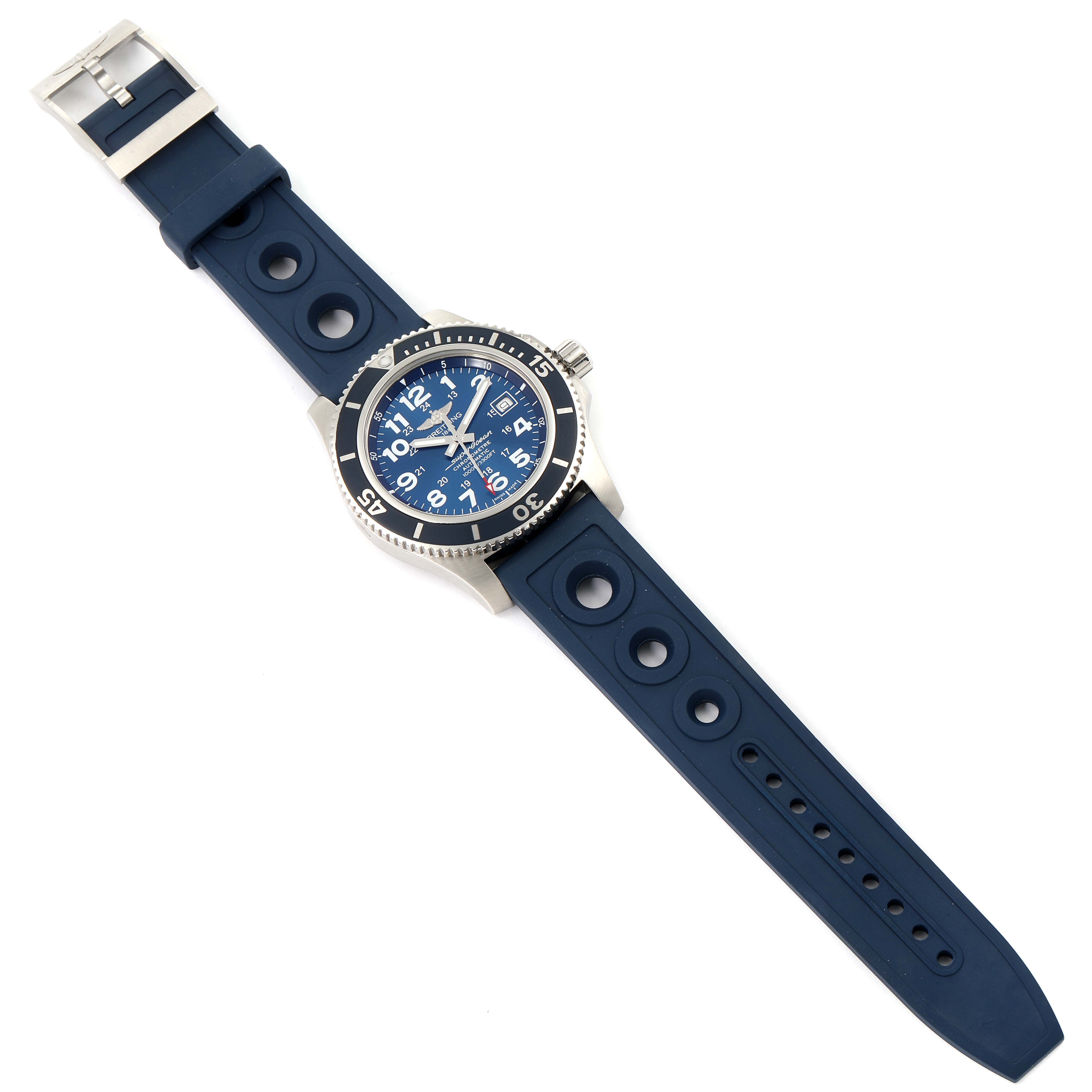 The image shows a top-down view of the Breitling Superocean A17392 Men
s Stainless Steel Blue Dial A17392 Men
s Stainless Steel Blue Dial watch with a blue dial and a matching blue perforated strap.