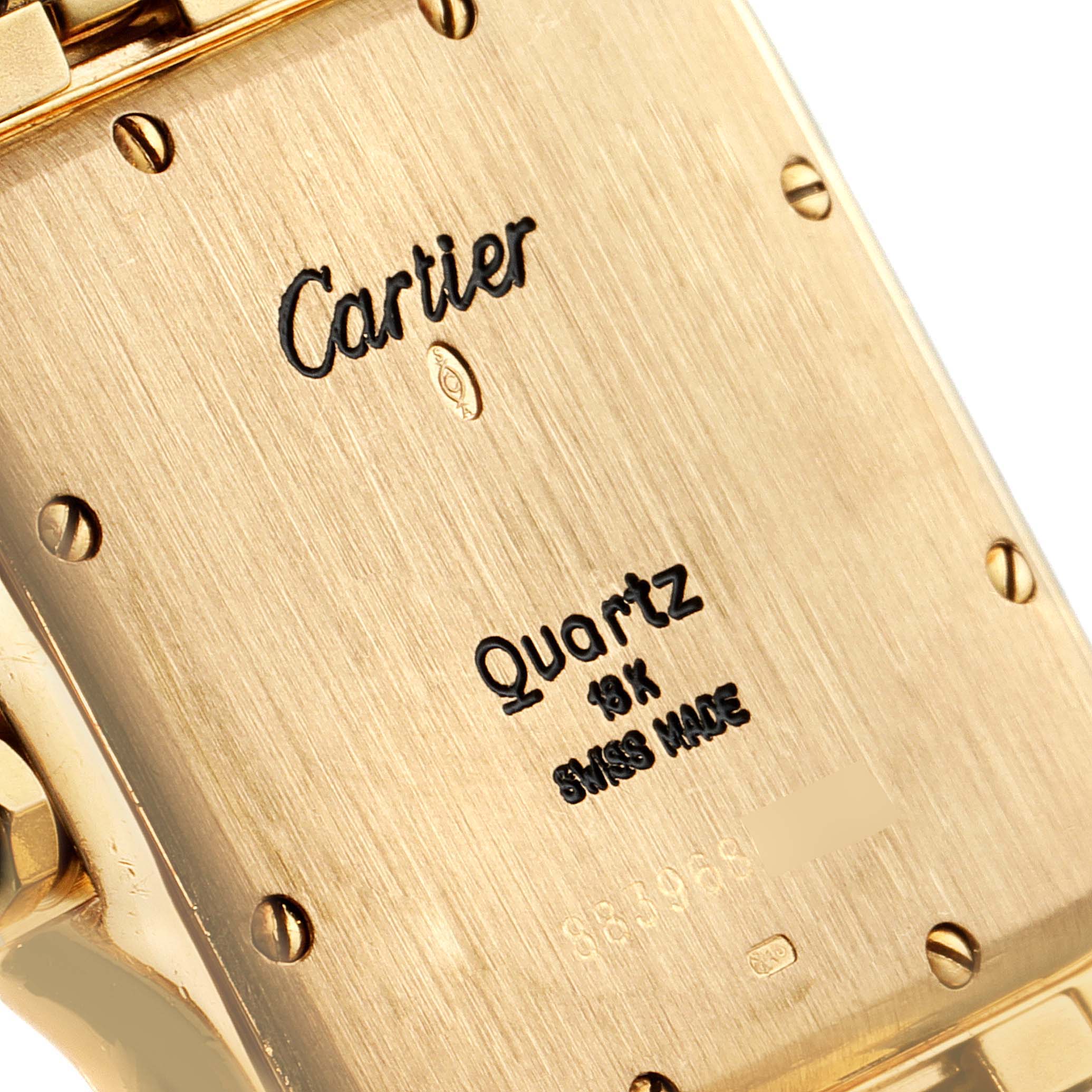 This image shows a close-up of the back case of a Cartier Panthere W25014B9 Men's Yellow Gold Silver Dial W25014B9 Men's Yellow Gold Silver Dial model watch, highlighting its inscriptions and screws.