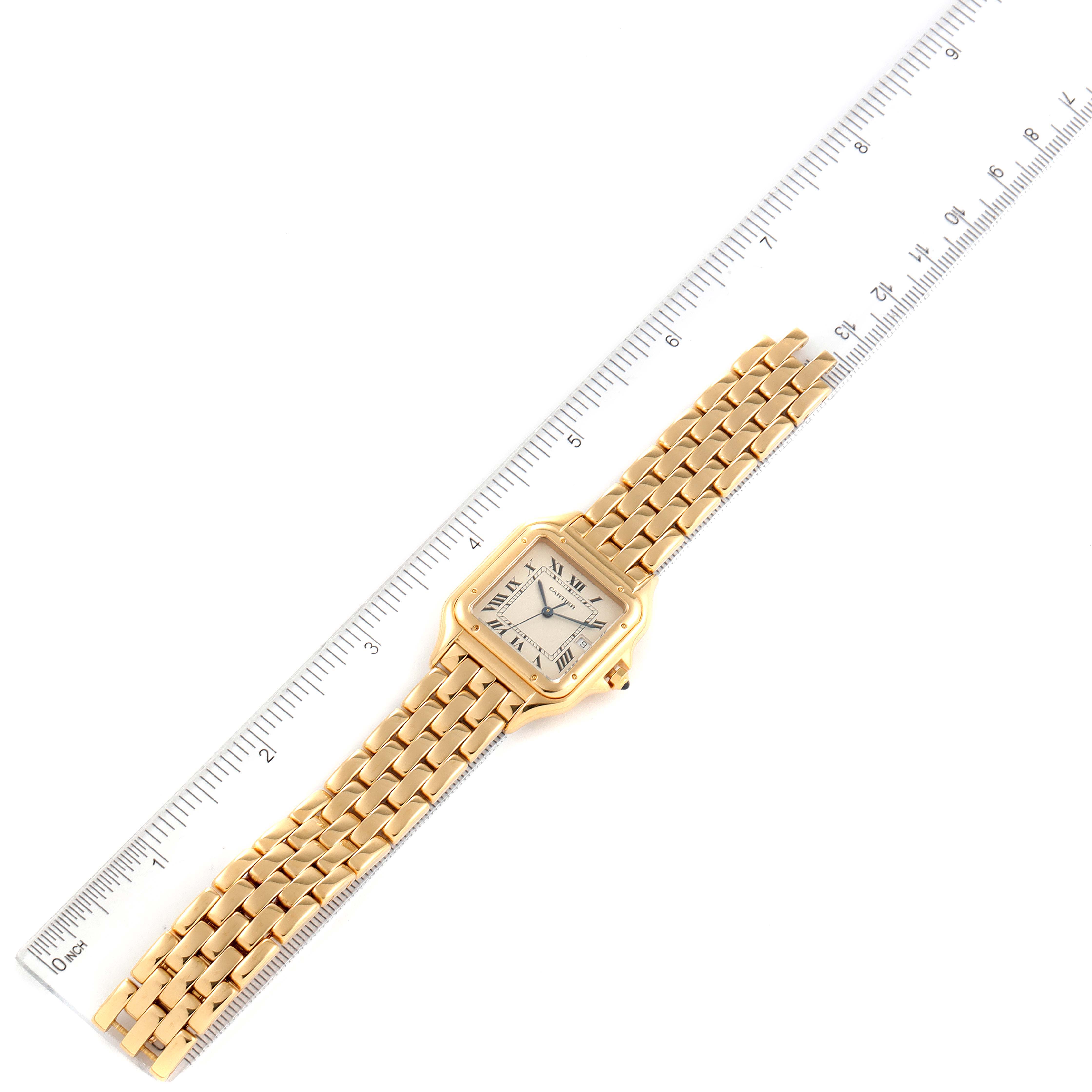 The Cartier Panthere W25014B9 Men's Yellow Gold Silver Dial W25014B9 Men's Yellow Gold Silver Dial watch is shown flat, positioned next to a ruler to display its dimensions.