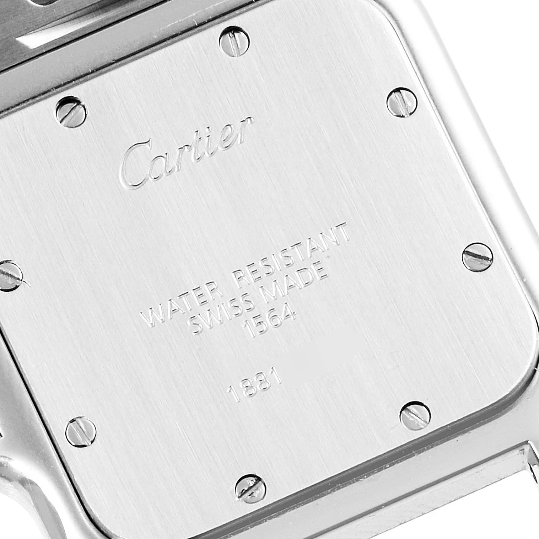 The image shows the back case of a Cartier Santos W20060D6 Men
s Stainless Steel Silver Dial W20060D6 Men
s Stainless Steel Silver Dial model watch, highlighting its screws and engraved text.