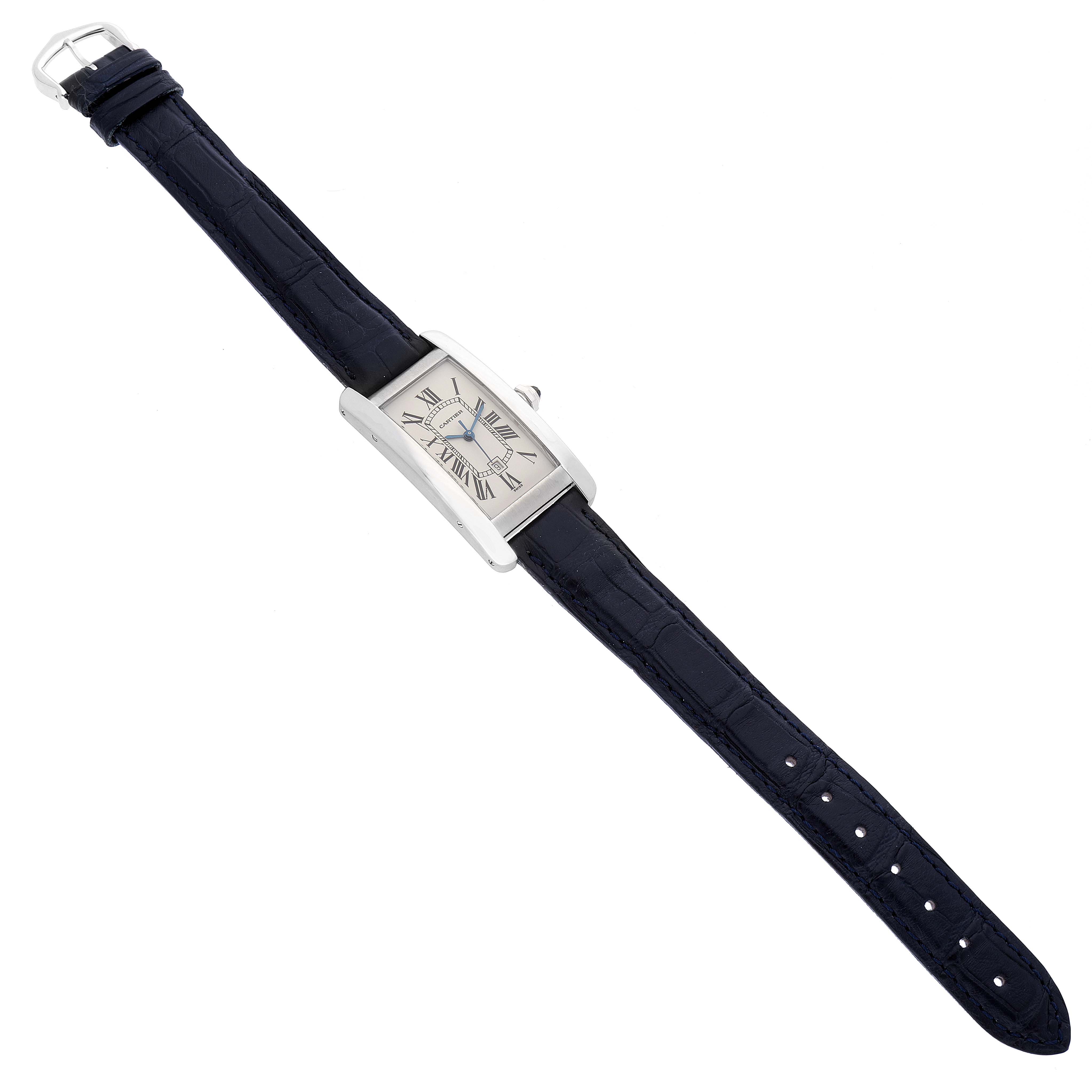 The image shows a top-down view of a Tank Americaine watch by Cartier, displaying the band, dial, and buckle.