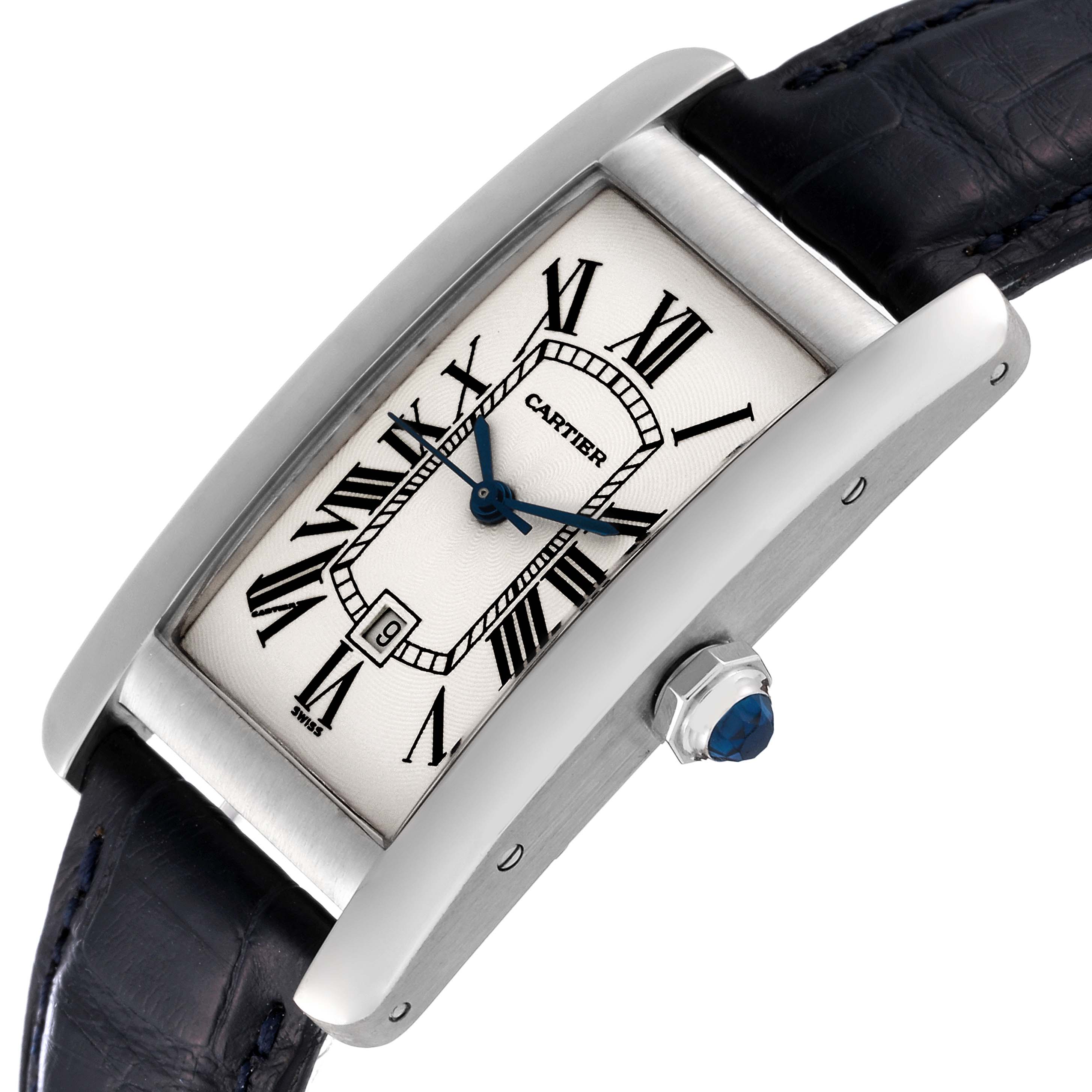 The image shows the face and side profile of the Cartier Tank Americaine W2603656 Women
s White Gold Silver Dial W2603656 Women
s White Gold Silver Dial watch, highlighting its Roman numerals and sapphire crown.