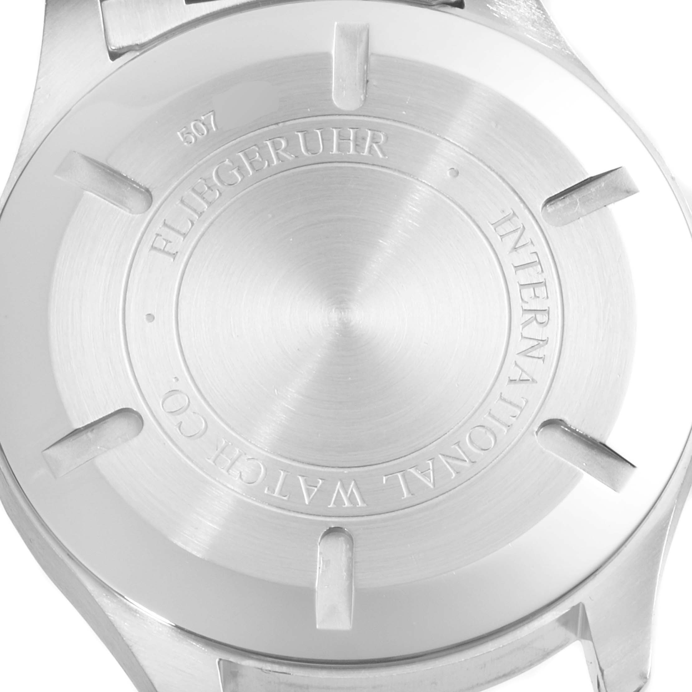 The image shows the back case of an IWC Pilot IW326504 Men's Stainless Steel Black Dial IW326504 Men's Stainless Steel Black Dial model watch, engraved with brand details.