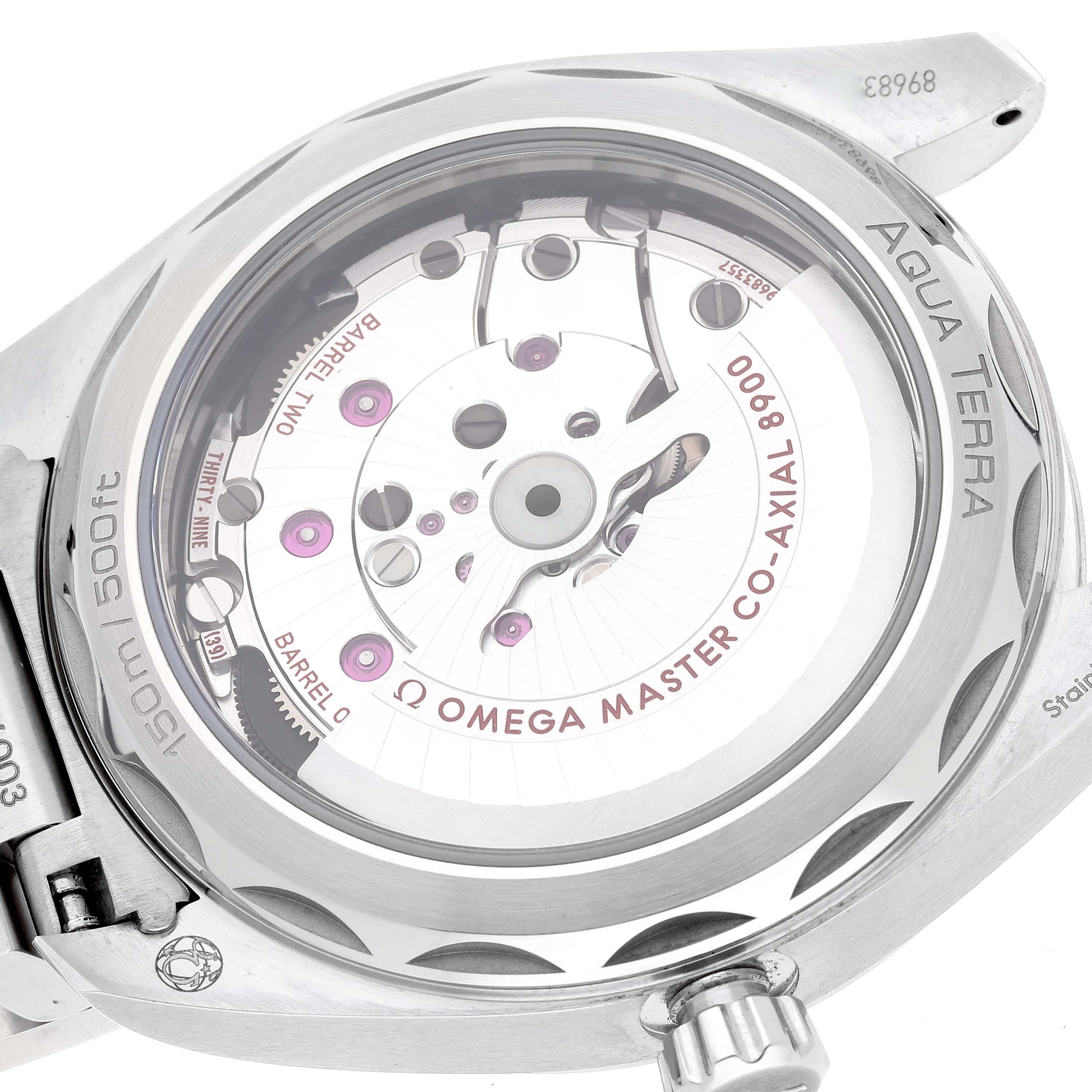 The image shows the back side of an Omega Aqua Terra 220.10.41.21.10.001 Men's Stainless Steel Green Dial 220.10.41.21.10.001 Men's Stainless Steel Green Dial watch, focusing on the visible movement through the transparent case back.