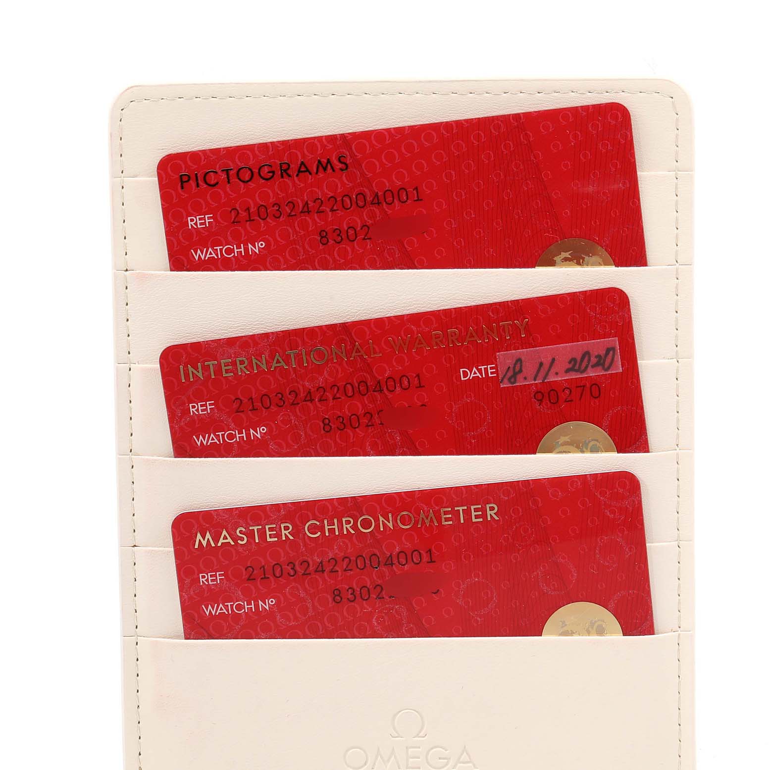 The image shows warranty and certification cards for the Omega Seamaster 210.32.42.20.04.001 Men
s Stainless Steel White Dial 210.32.42.20.04.001 Men
s Stainless Steel White Dial model, stored in a white cardholder.