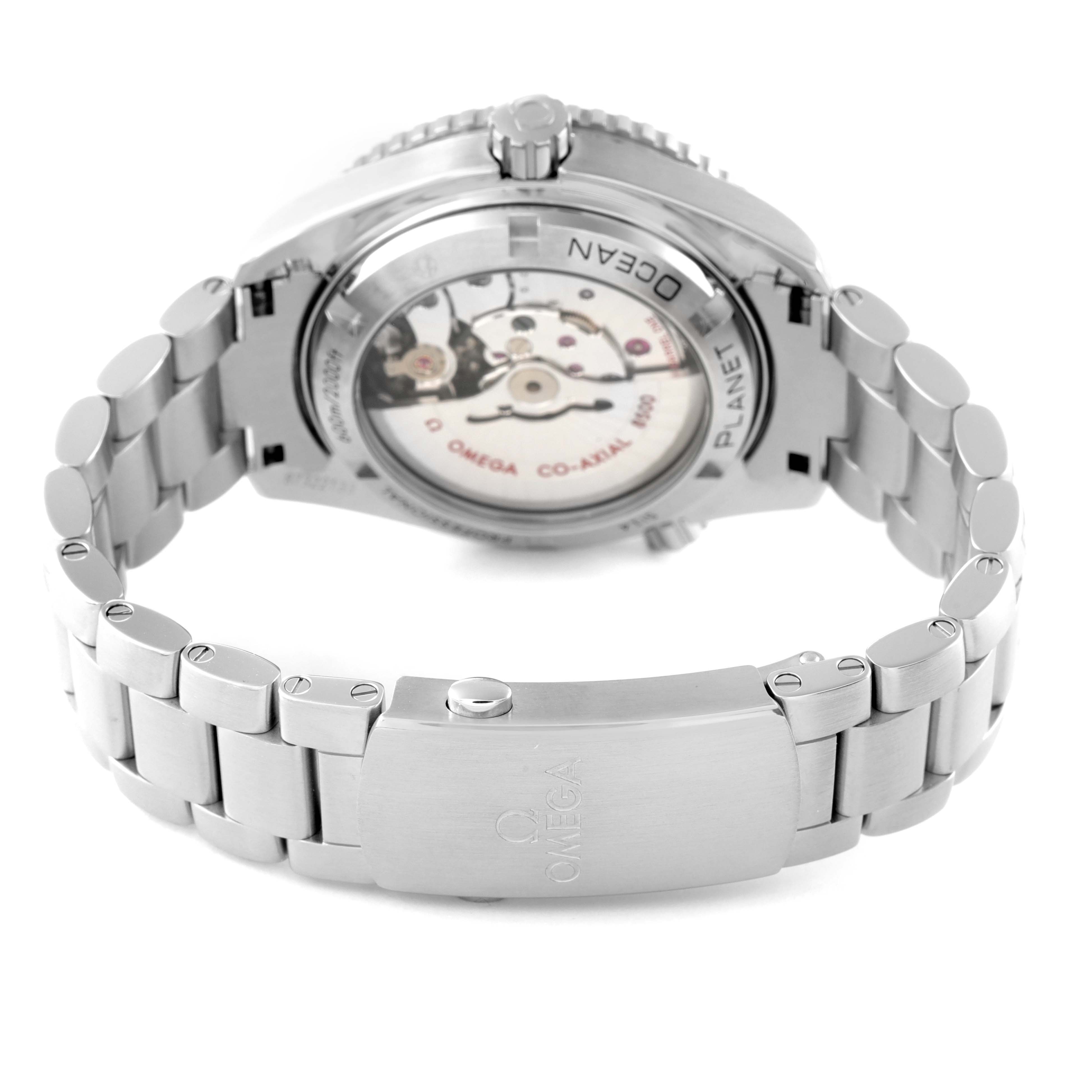 The image shows the back view of the Omega Planet Ocean 232.30.42.21.01.002 Men
s Stainless Steel Black Dial 232.30.42.21.01.002 Men
s Stainless Steel Black Dial watch, highlighting its transparent case back and metal bracelet.