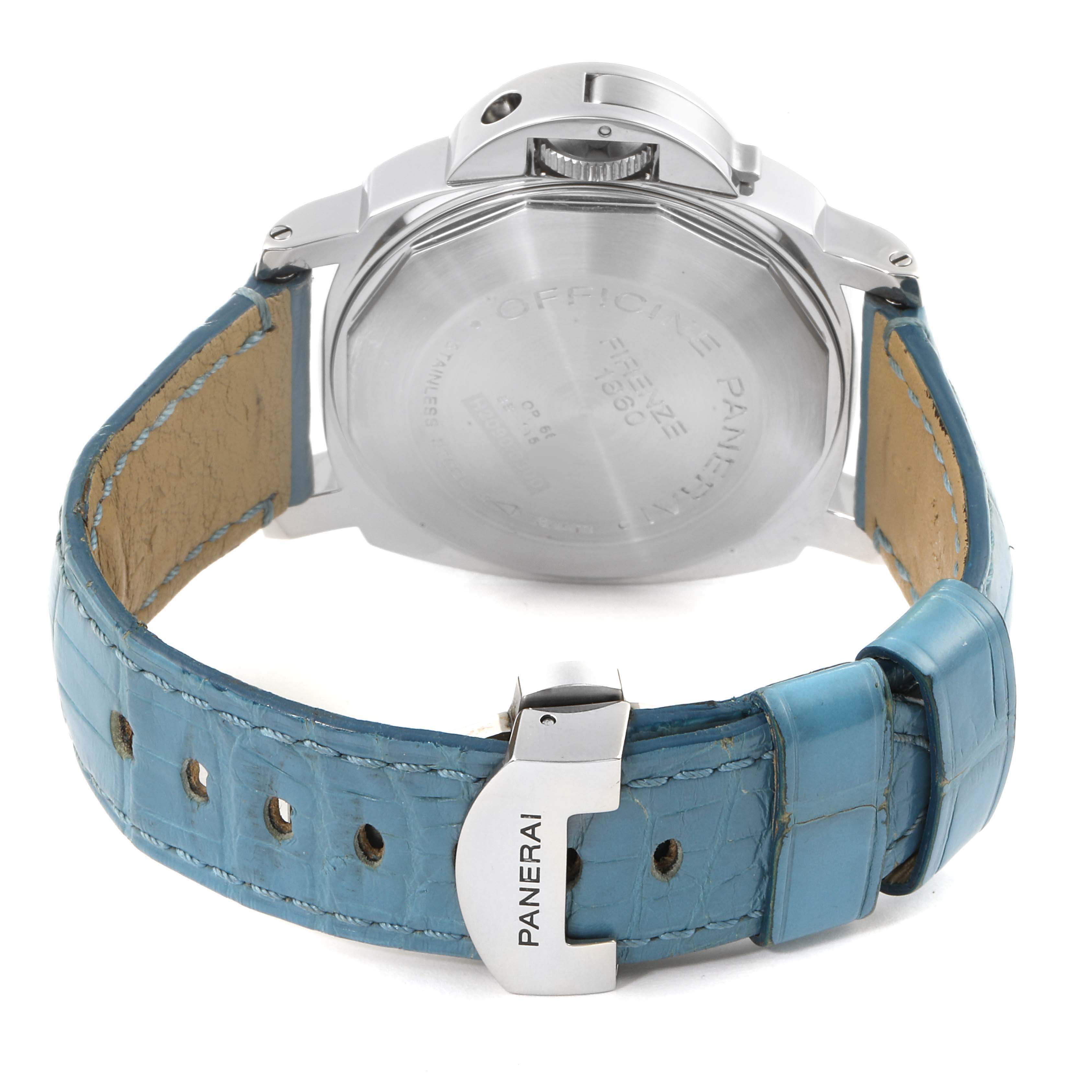 The image shows the back view of a Panerai Luminor PAM00104 Men
s Stainless Steel Black Dial PAM00104 Men
s Stainless Steel Black Dial watch, highlighting its case back, crown, and blue leather strap with the buckle.