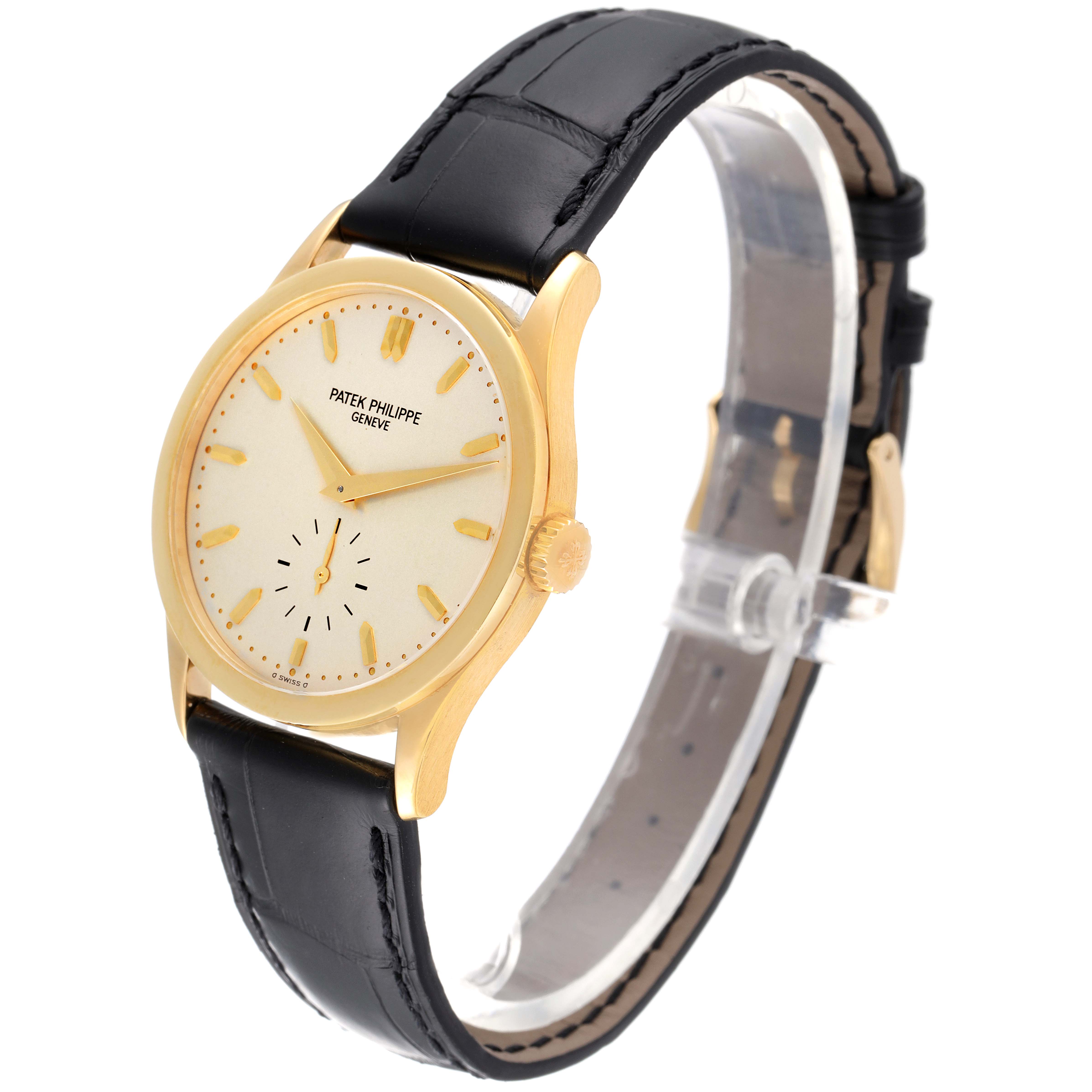 The image shows a Patek Philippe Calatrava 5096J Men's Yellow Gold Silver Dial 5096J Men's Yellow Gold Silver Dial watch at a three-quarter angle, highlighting the dial, case, and black leather strap.